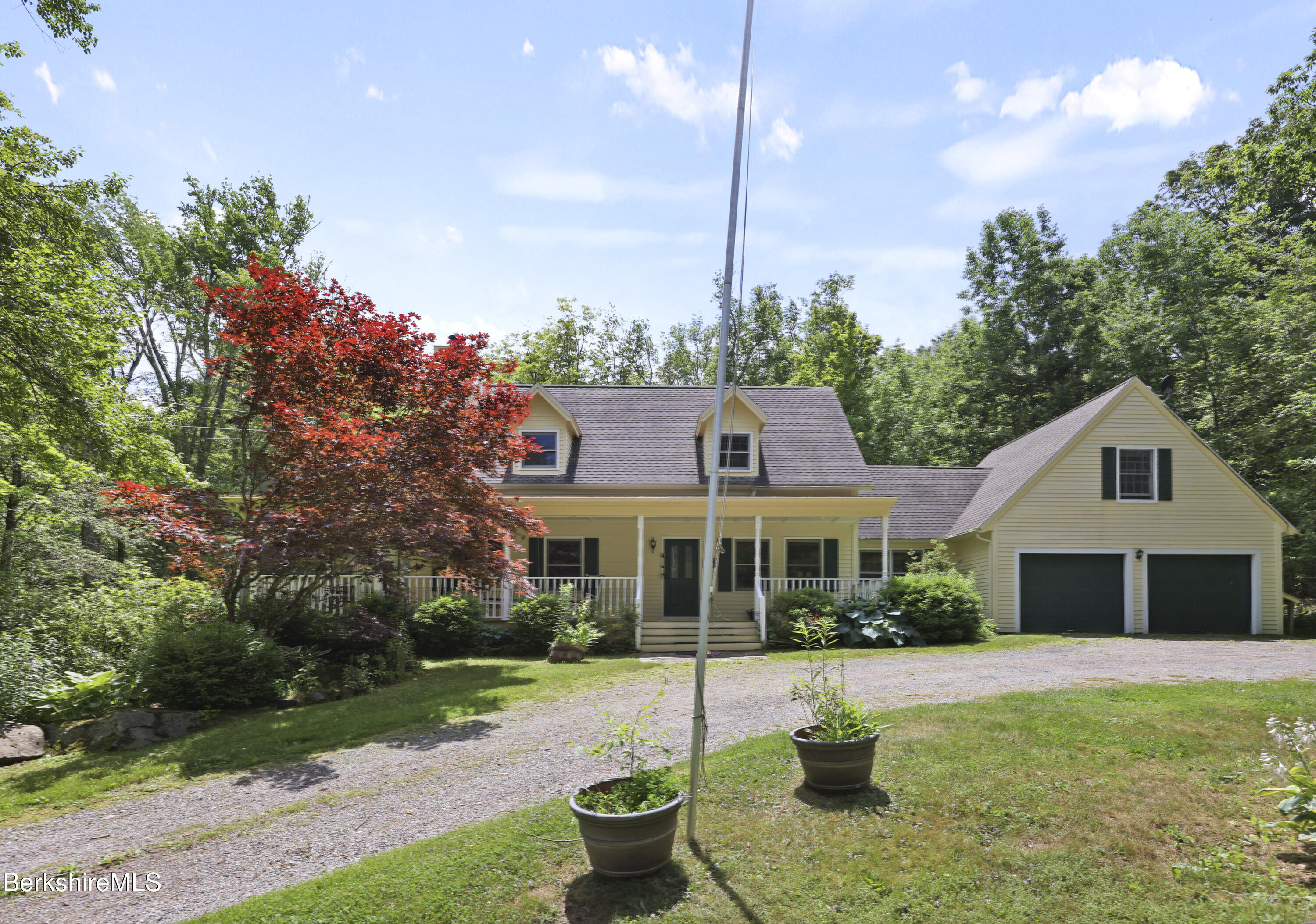 169 Jacobs Hollow Road Becket, MA 01223 - Photo 5 of 73 a front view of a house with a yard