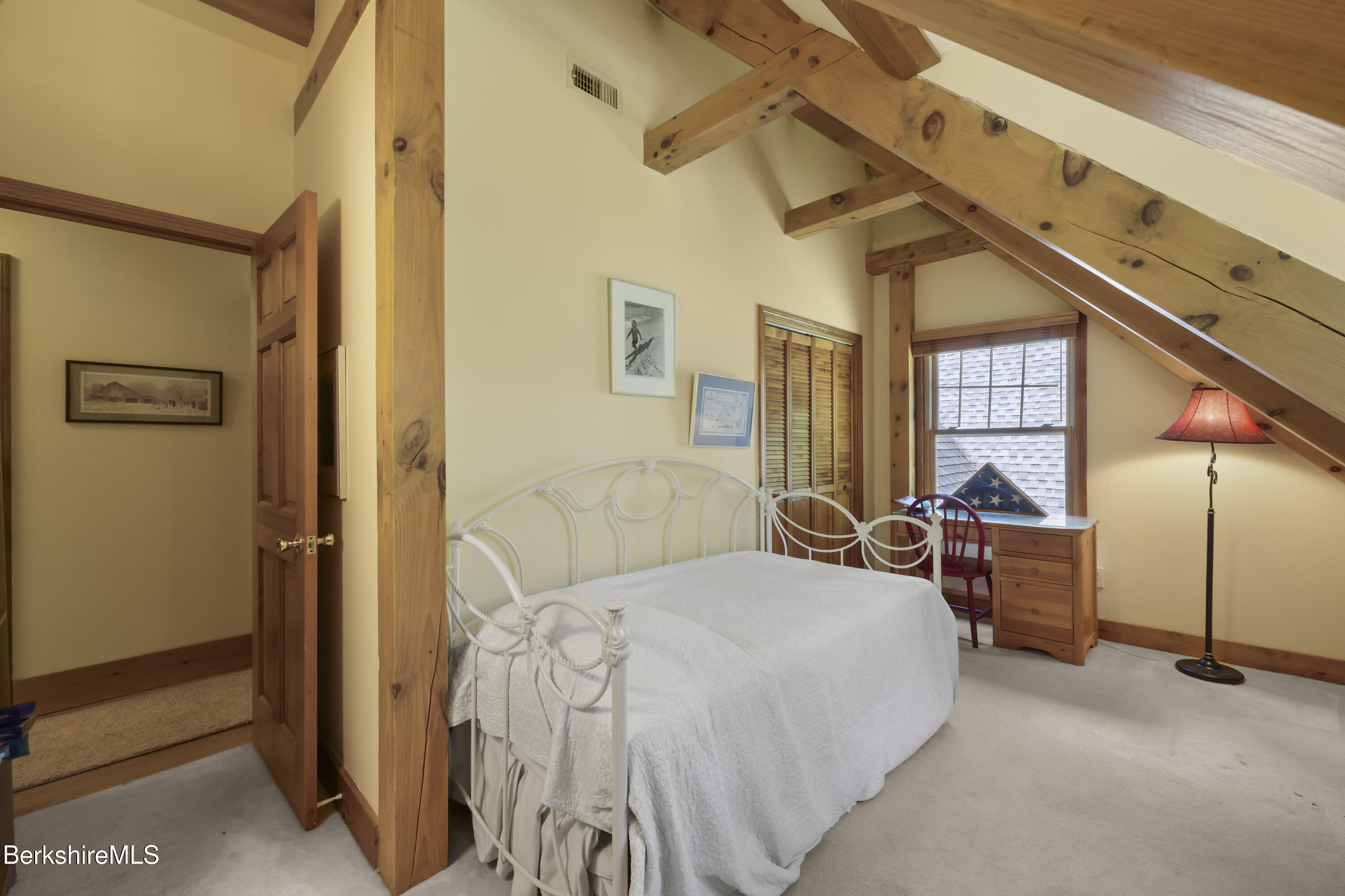 169 Jacobs Hollow Road Becket, MA 01223 - Photo 54 of 73 a bedroom with a bed next to a window