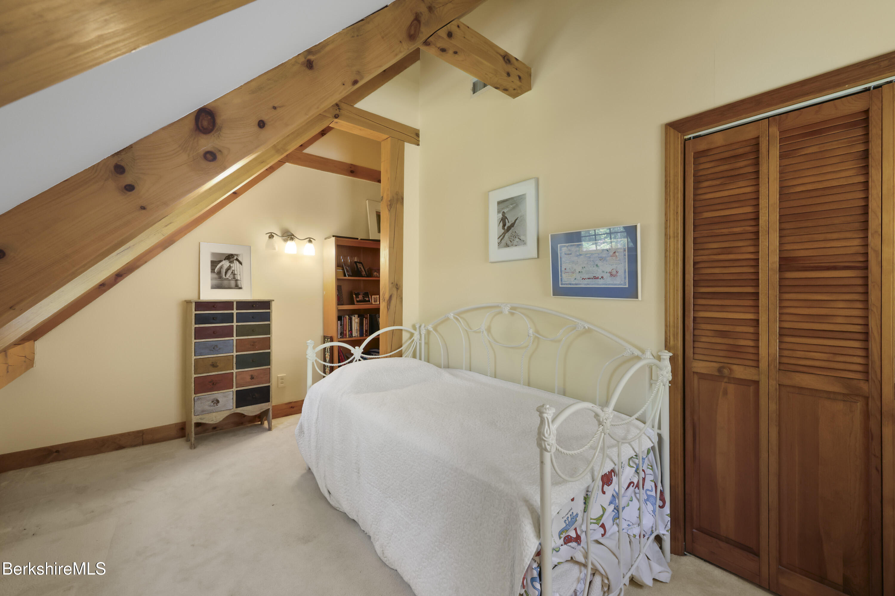 169 Jacobs Hollow Road Becket, MA 01223 - Photo 55 of 73 a bedroom with a bed and a walk in closet