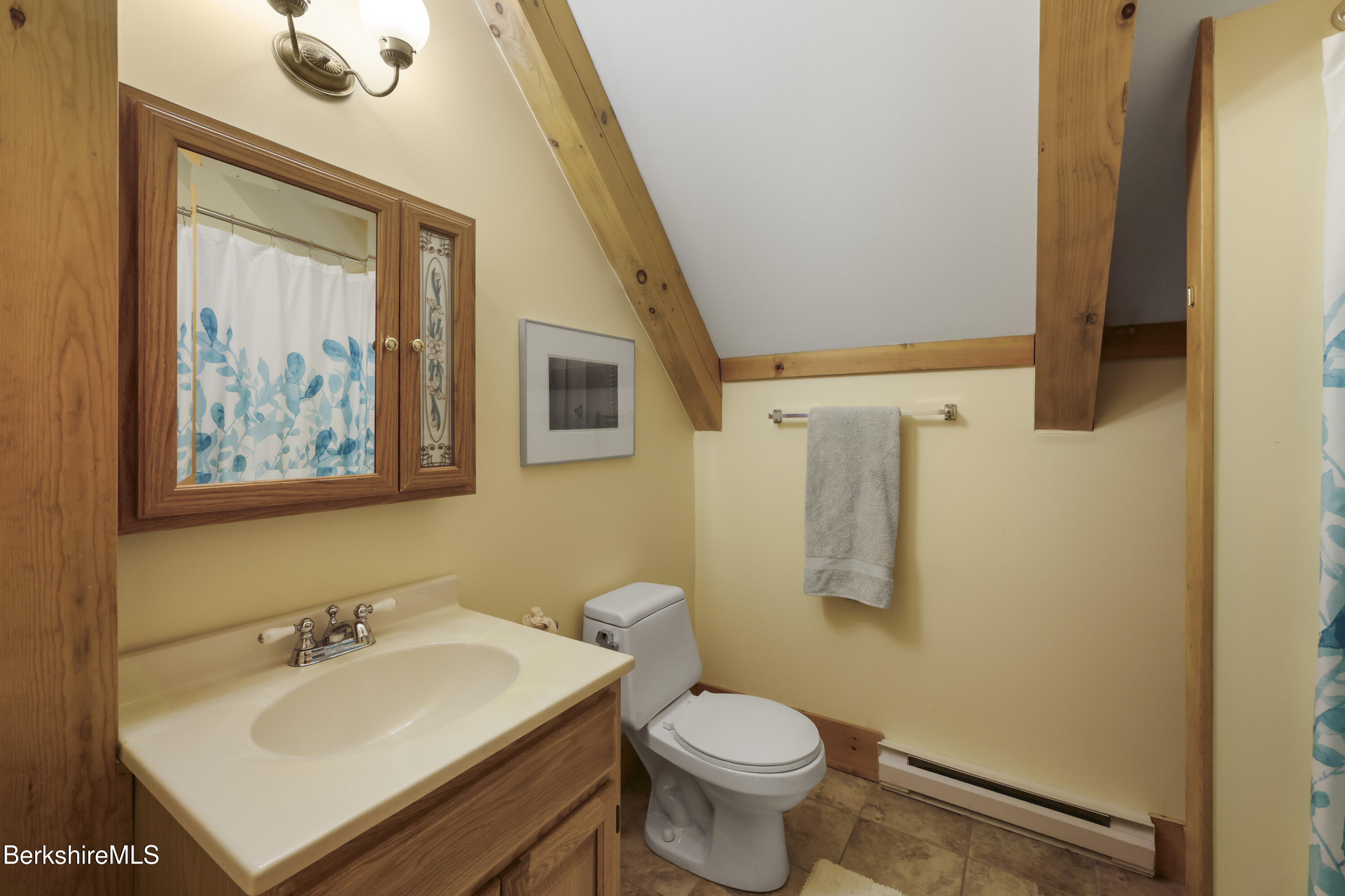 169 Jacobs Hollow Road Becket, MA 01223 - Photo 56 of 73 a bathroom with a sink mirror and toilet