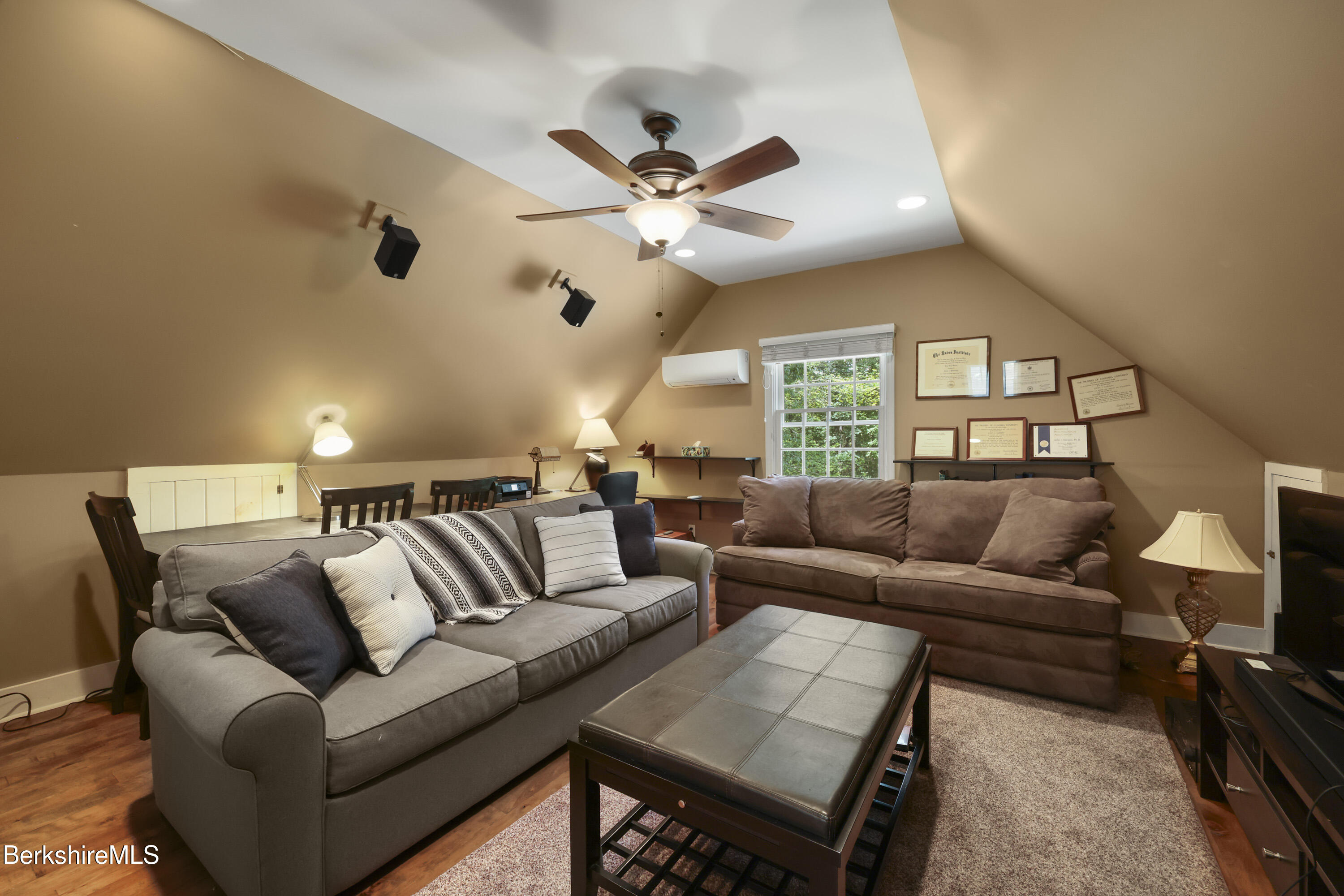 169 Jacobs Hollow Road Becket, MA 01223 - Photo 58 of 73 a living room with furniture and a large window with wooden floor