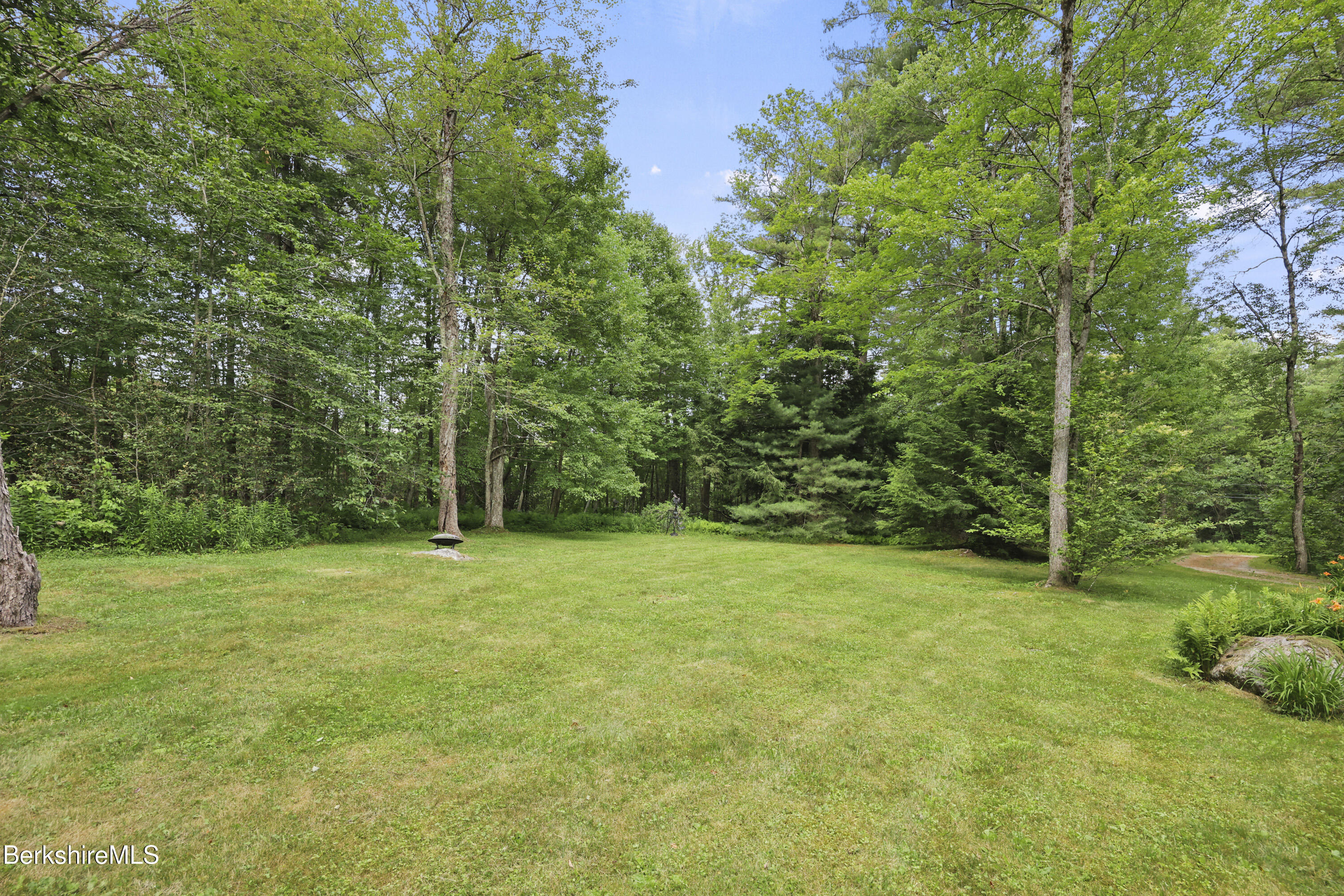 169 Jacobs Hollow Road Becket, MA 01223 - Photo 68 of 73 a view of a field with trees in the background