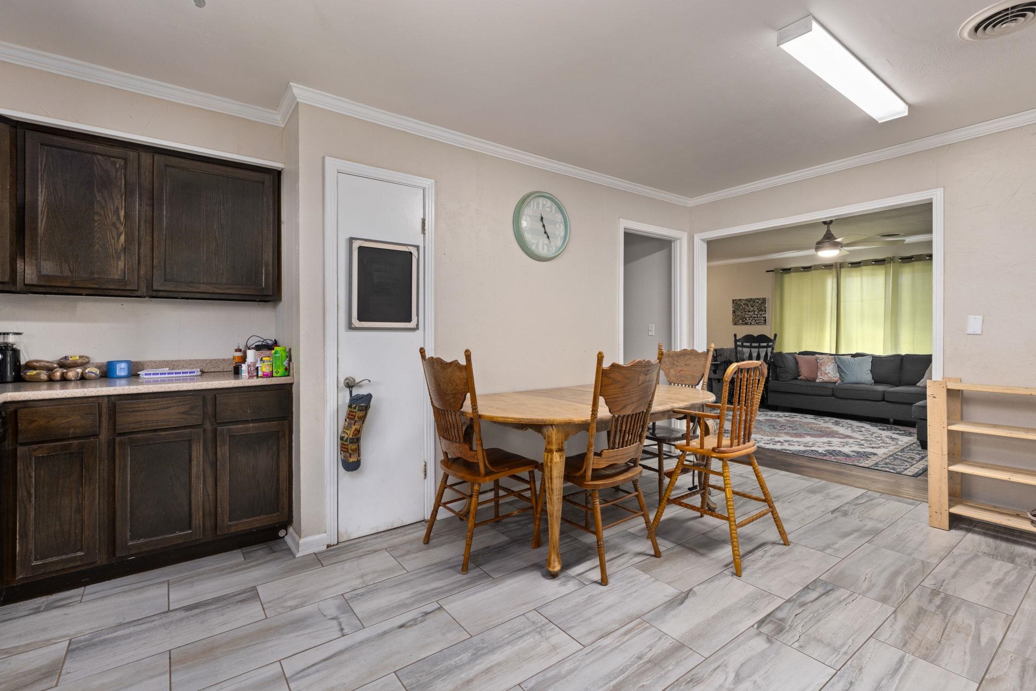102 West 5th Street Iuka, MS 38852 - Photo 21 of 33 a view of a dining room with furniture and wooden floor