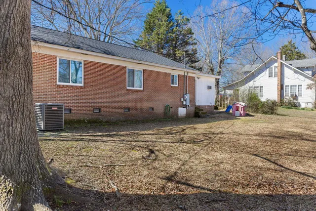 a view of yard with wooden fence