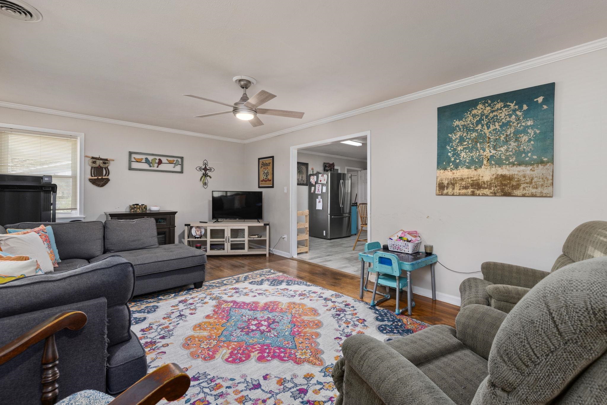 102 West 5th Street Iuka, MS 38852 - Photo 4 of 33 a living room with furniture and a flat screen tv