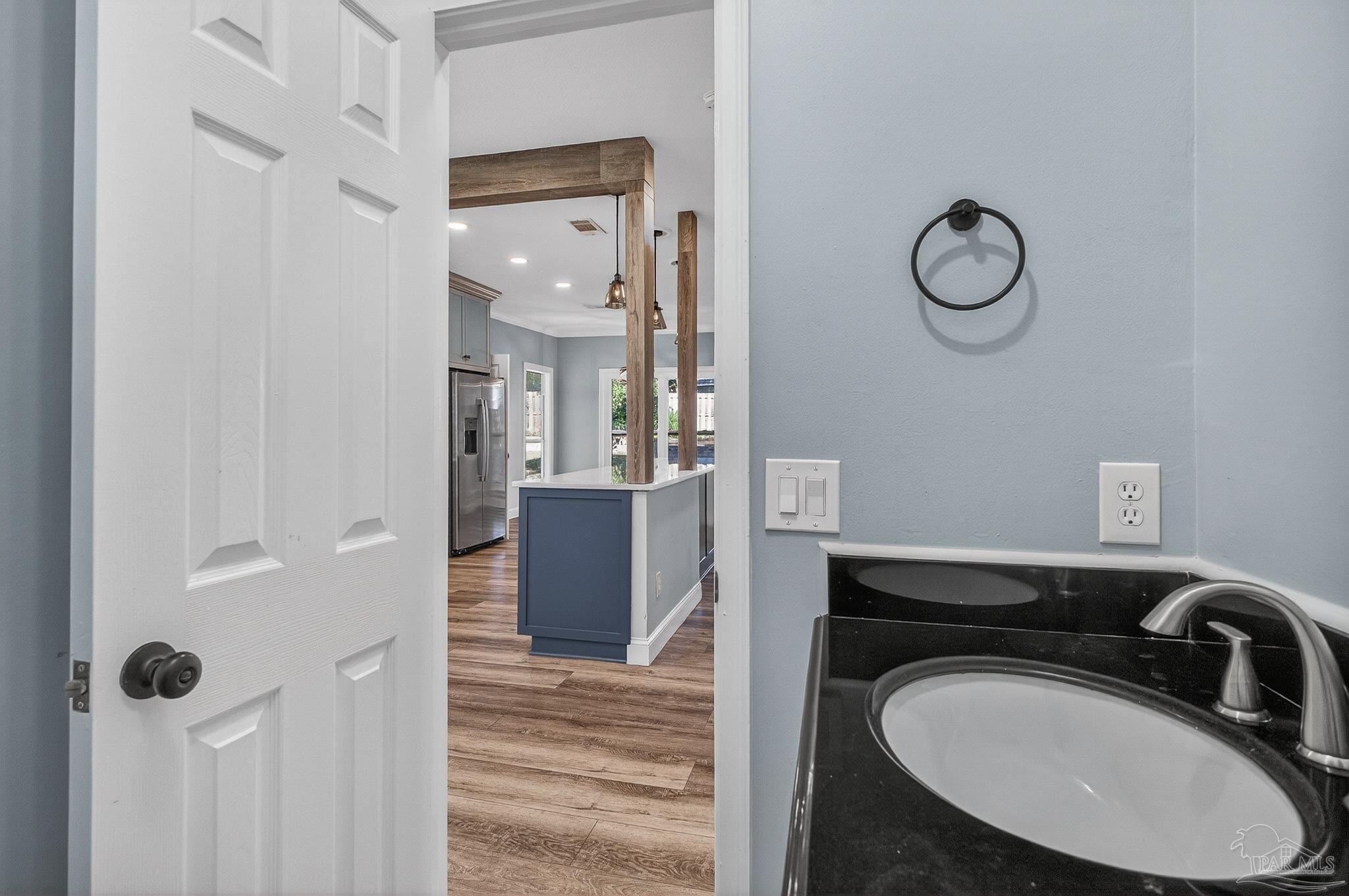 16360 Innerarity Point Road Pensacola, FL 32507 - Photo 14 of 56 a bathroom with a sink and a mirror