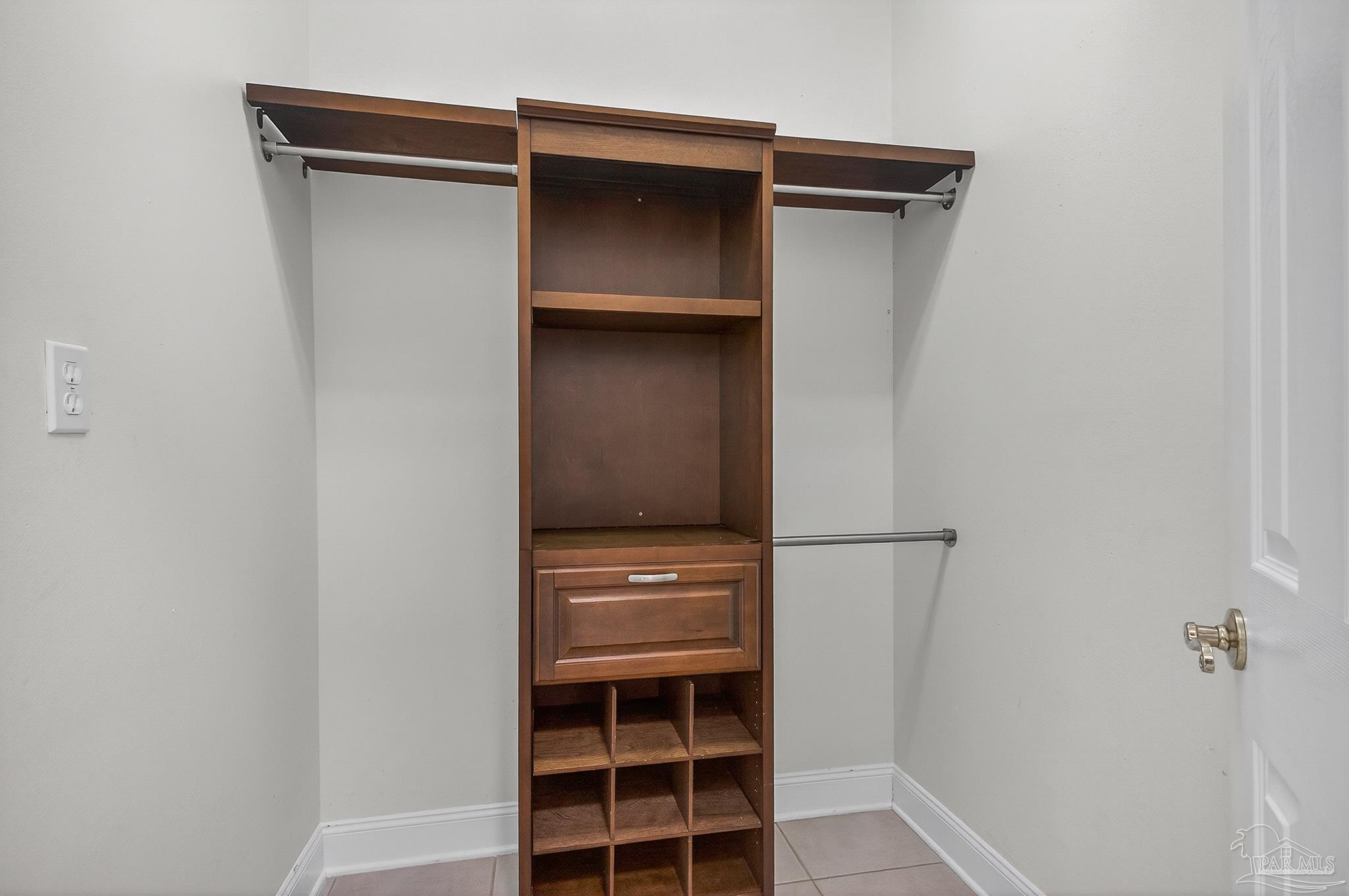 16360 Innerarity Point Road Pensacola, FL 32507 - Photo 26 of 56 a view of walk in closet with empty racks