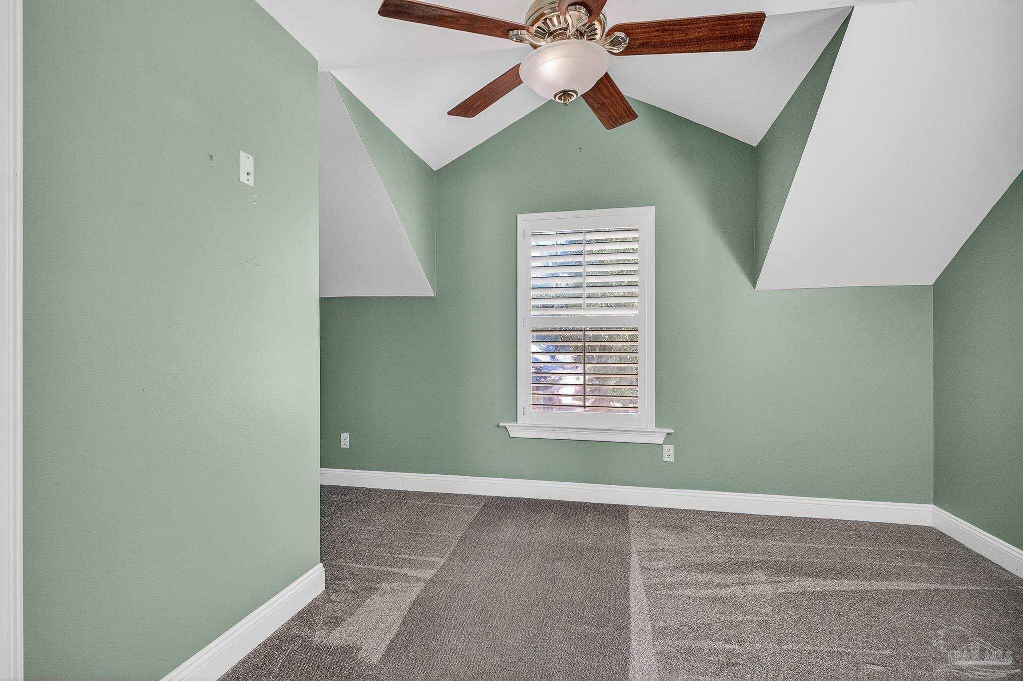 16360 Innerarity Point Road Pensacola, FL 32507 - Photo 30 of 56 an empty room with windows and fan