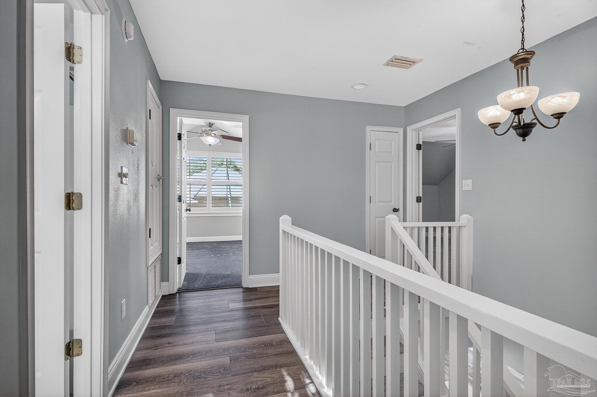 16360 Innerarity Point Road Pensacola, FL 32507 - Photo 34 of 56 a view of a hallway with wooden floor and entryway