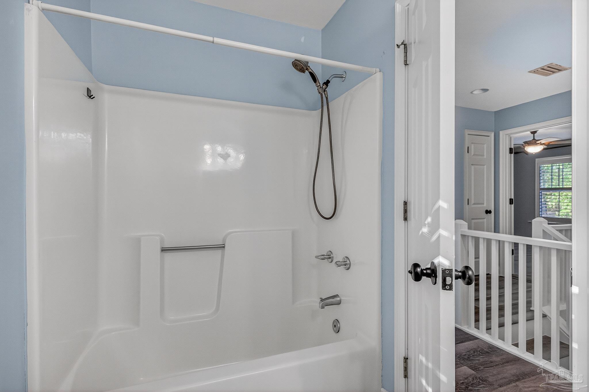 16360 Innerarity Point Road Pensacola, FL 32507 - Photo 36 of 56 a bathroom with a bath tub with a shower