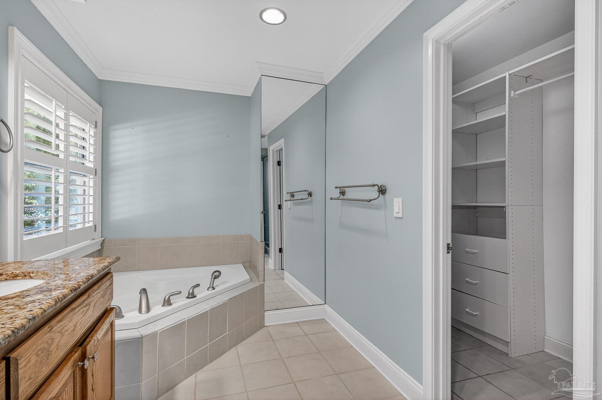 16360 Innerarity Point Road Pensacola, FL 32507 - Photo 45 of 56 a bathroom with a bathtub and a shower