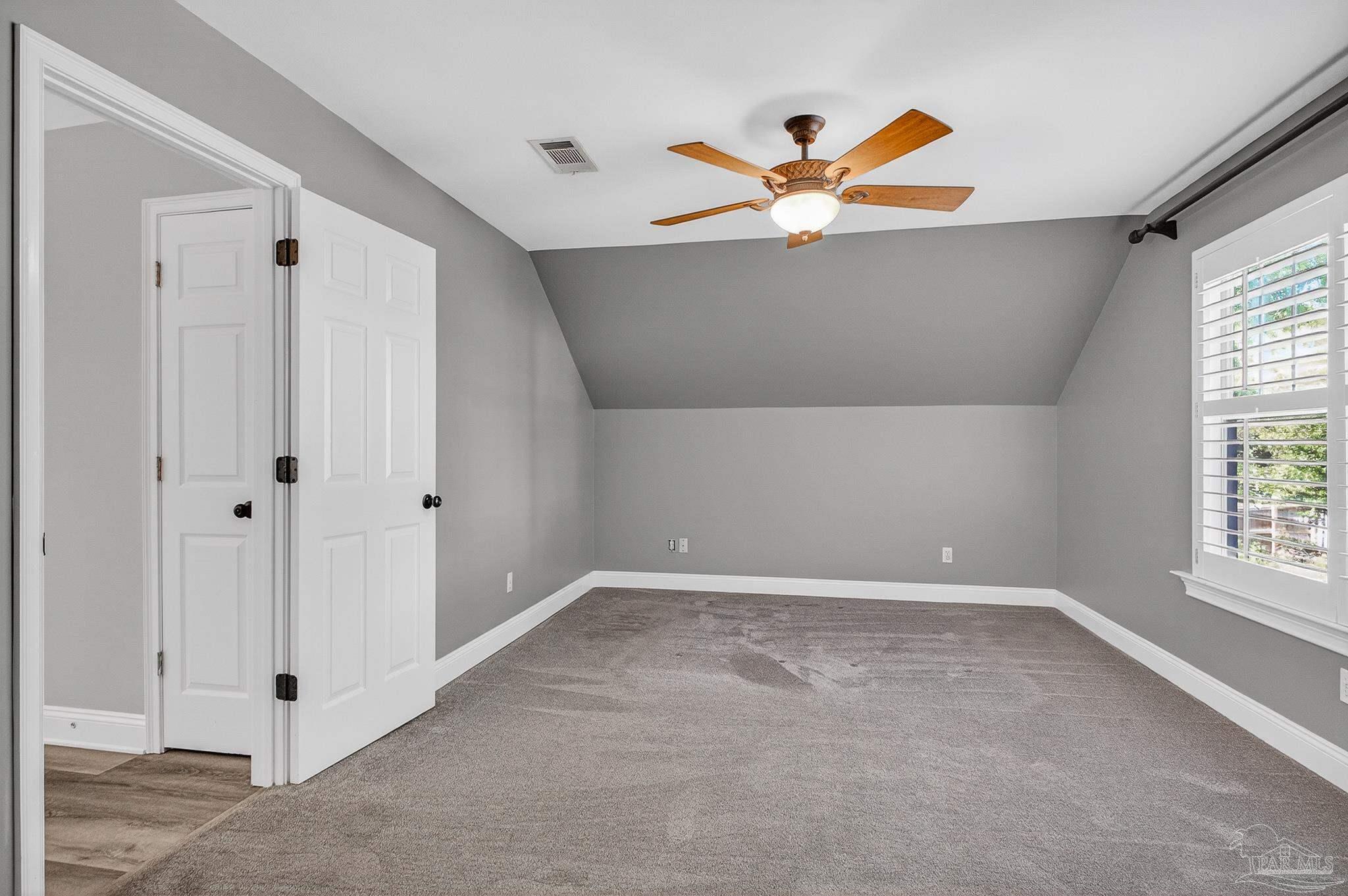 16360 Innerarity Point Road Pensacola, FL 32507 - Photo 50 of 56 a view of a livingroom with a ceiling fan and window