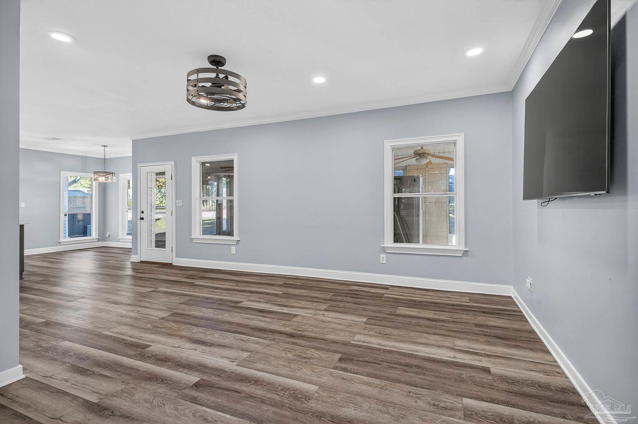 16360 Innerarity Point Road Pensacola, FL 32507 - Photo 5 of 56 a view of an empty room with a window and wooden floor