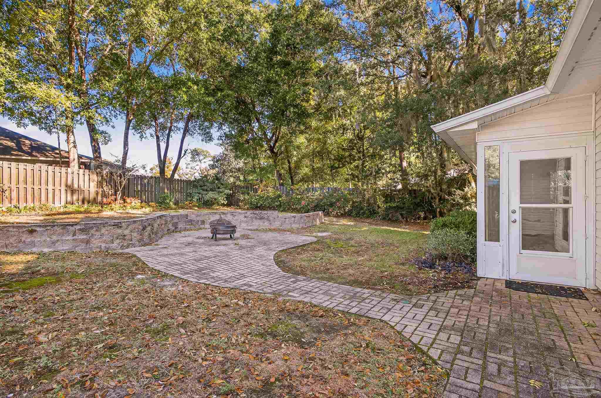 16360 Innerarity Point Road Pensacola, FL 32507 - Photo 53 of 56 a view of a yard with plants and trees