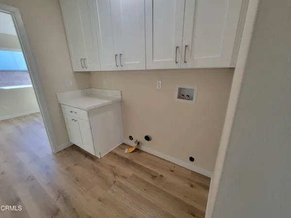 a view of cabinets with wooden floor