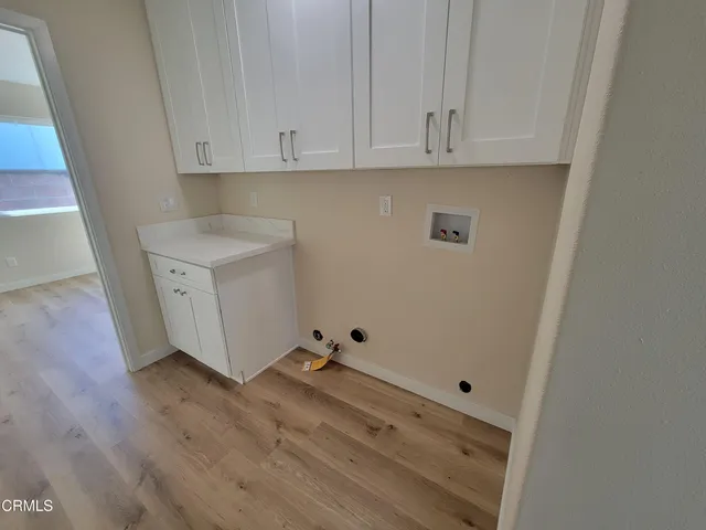 a view of cabinets with wooden floor