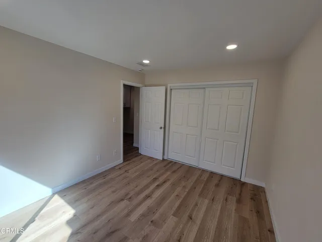 a view of a livingroom with wooden floor