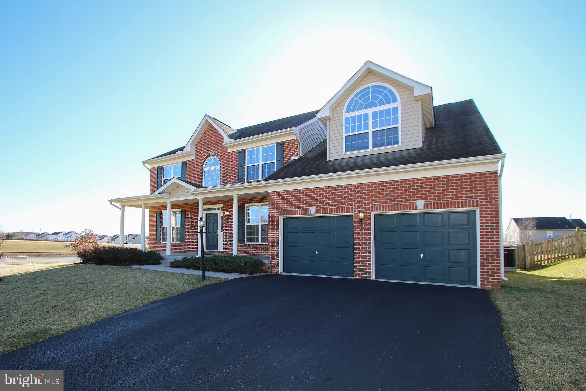 3905 Calico Circle Point of Rocks, MD 21777 - Photo 1 of 30 a front view of a house with a yard and garage