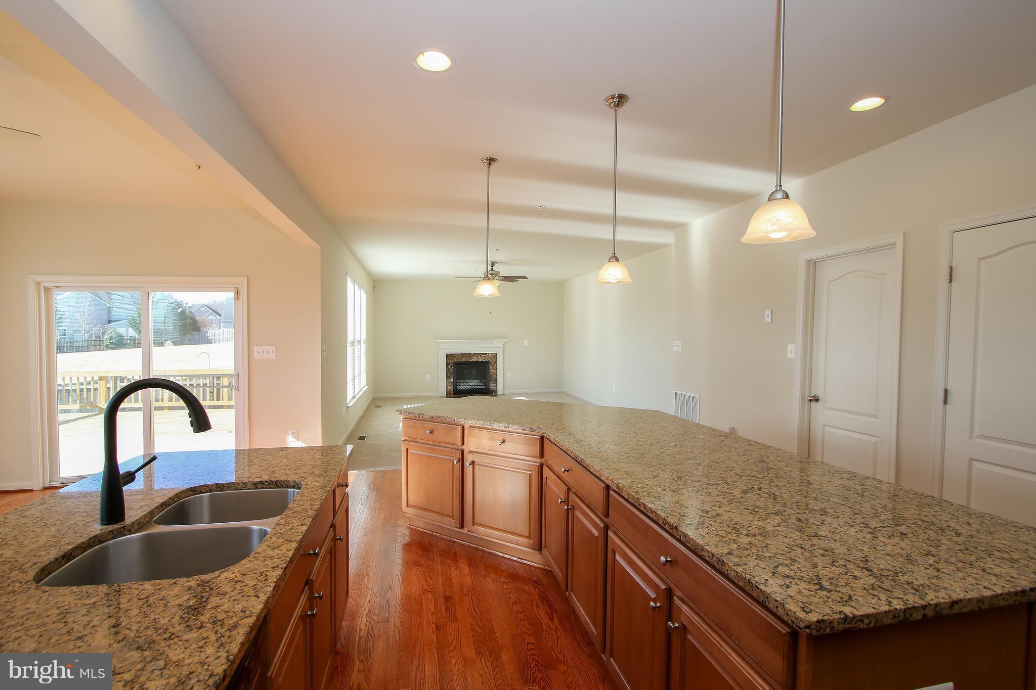 3905 Calico Circle Point of Rocks, MD 21777 - Photo 11 of 30 a kitchen with sink refrigerator and stove