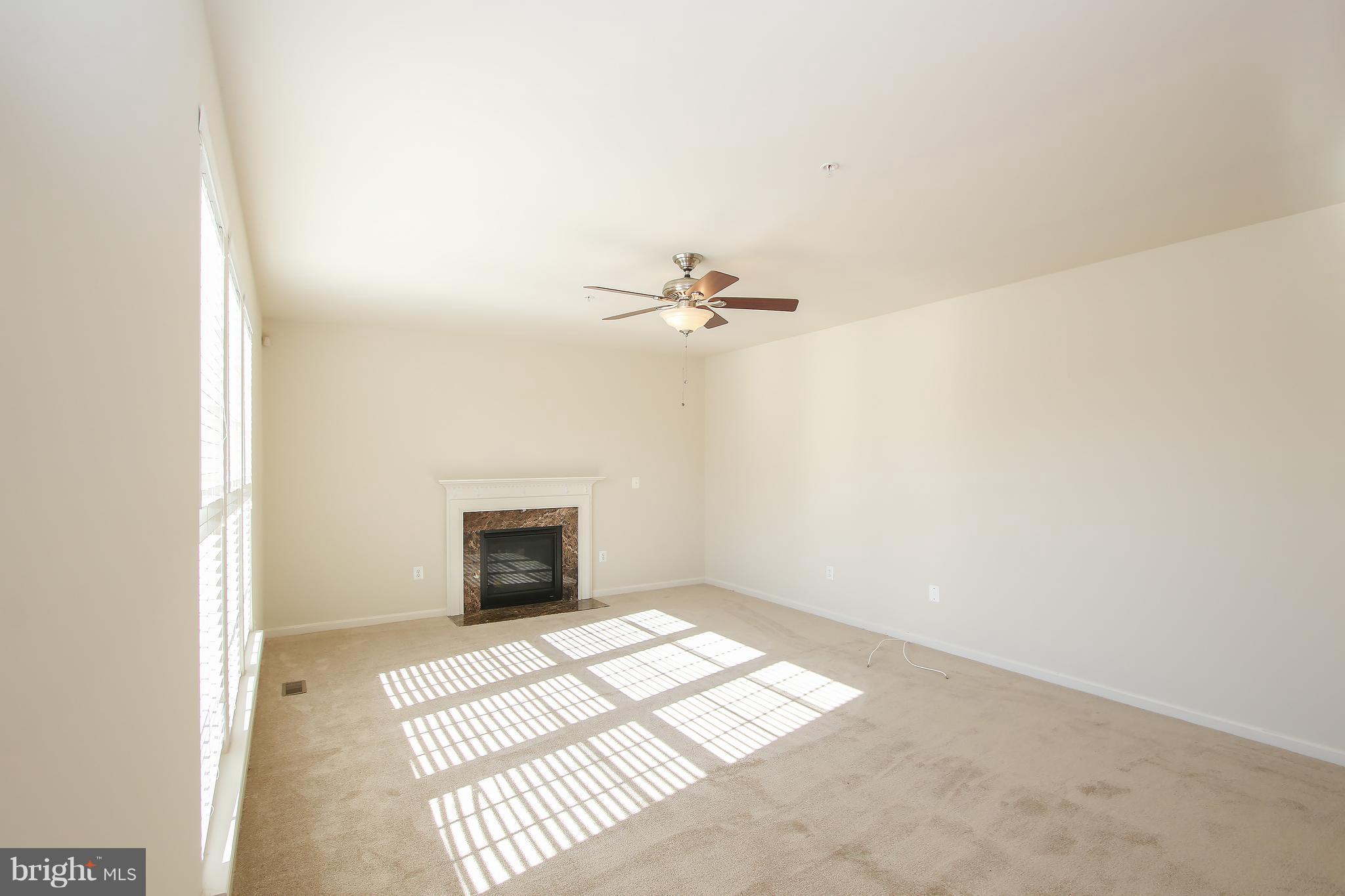 3905 Calico Circle Point of Rocks, MD 21777 - Photo 13 of 30 an empty room with windows and fireplace