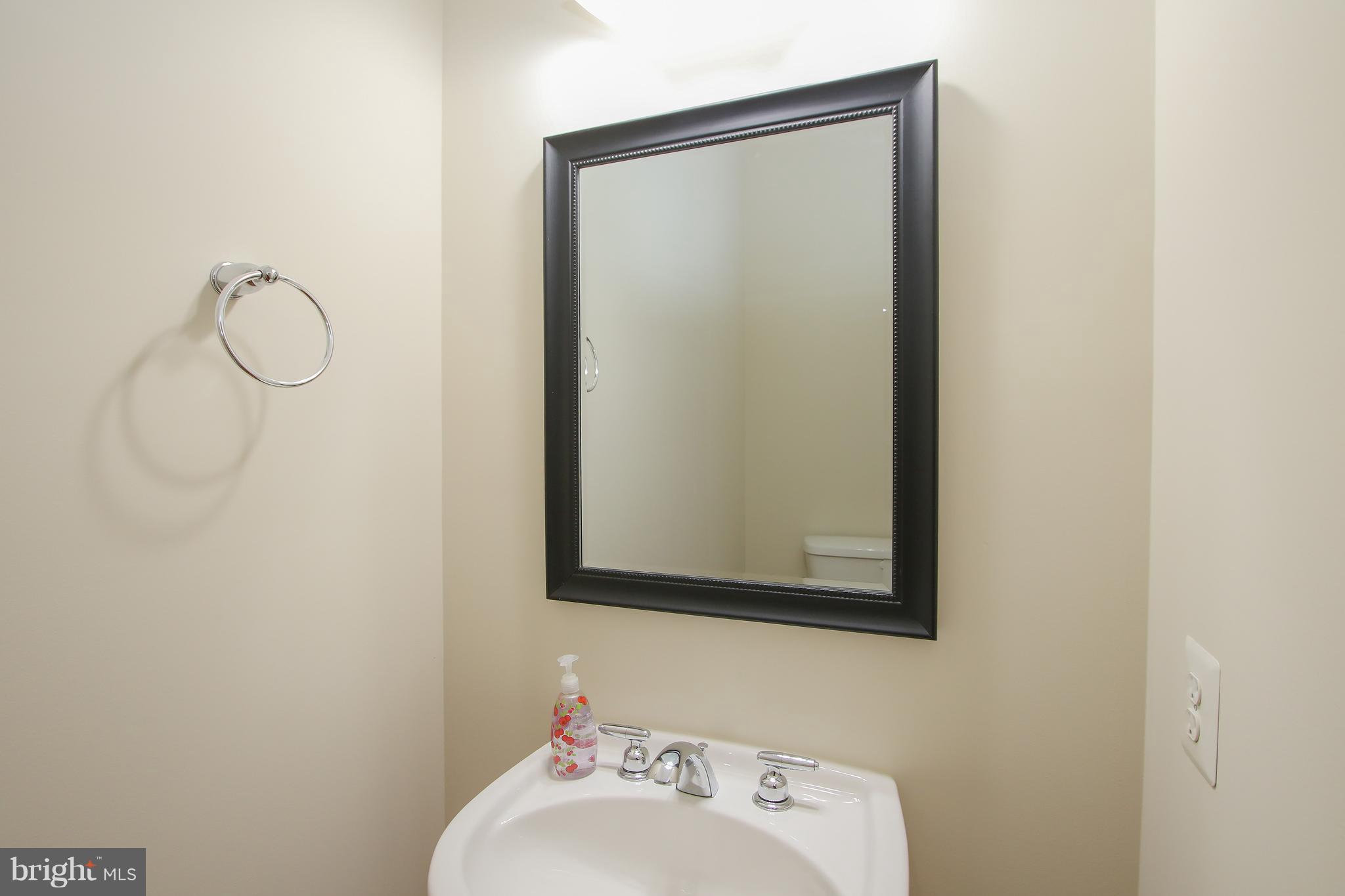 3905 Calico Circle Point of Rocks, MD 21777 - Photo 15 of 30 a bathroom with a sink and mirror