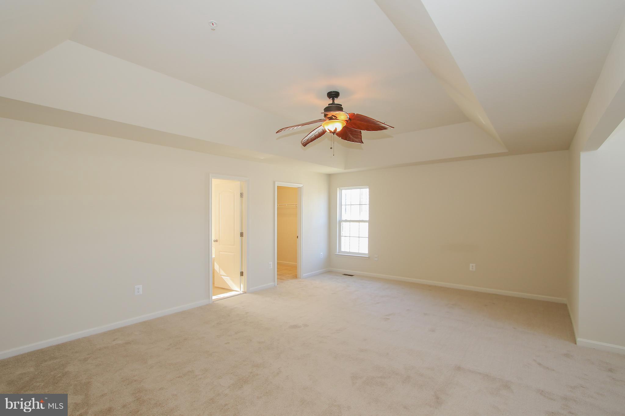 3905 Calico Circle Point of Rocks, MD 21777 - Photo 17 of 30 a view of a livingroom with a ceiling fan and window