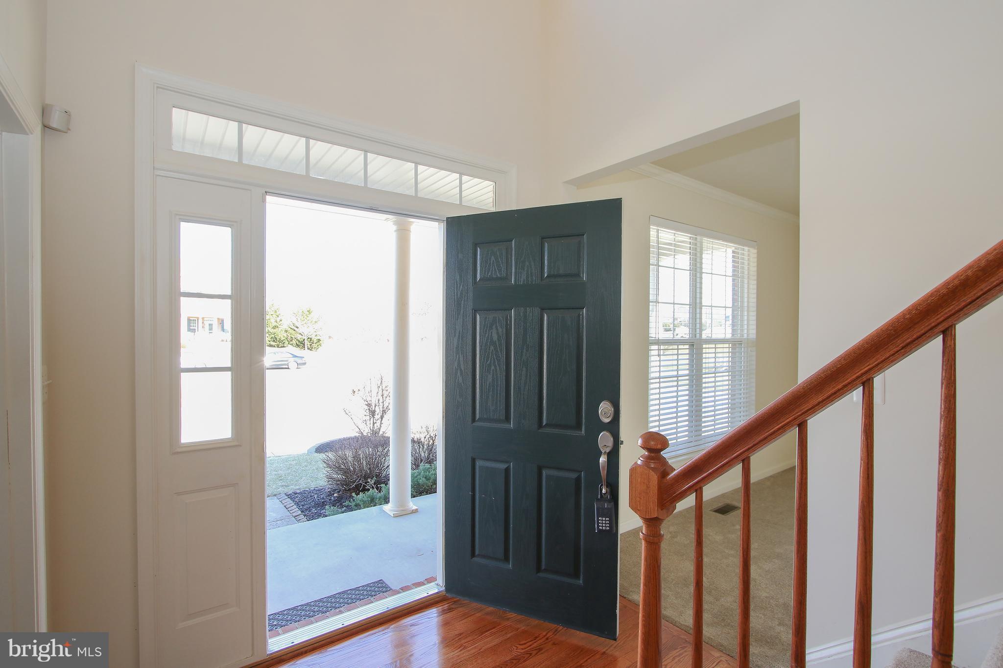3905 Calico Circle Point of Rocks, MD 21777 - Photo 3 of 30 a view of an entryway with wooden floor and door