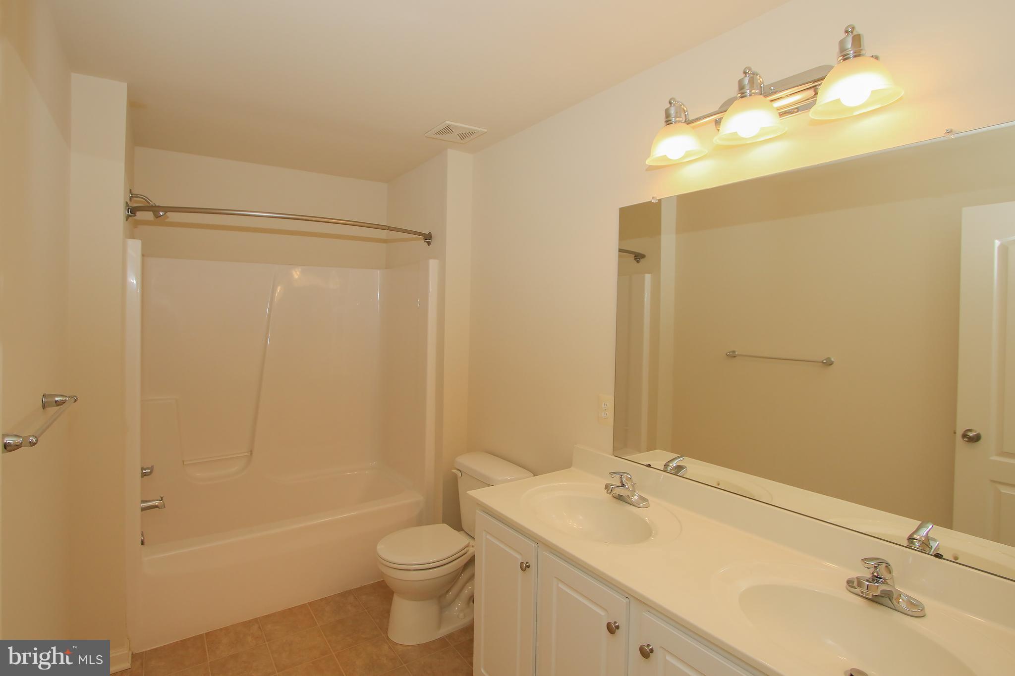 3905 Calico Circle Point of Rocks, MD 21777 - Photo 21 of 30 a bathroom with a sink a toilet and shower