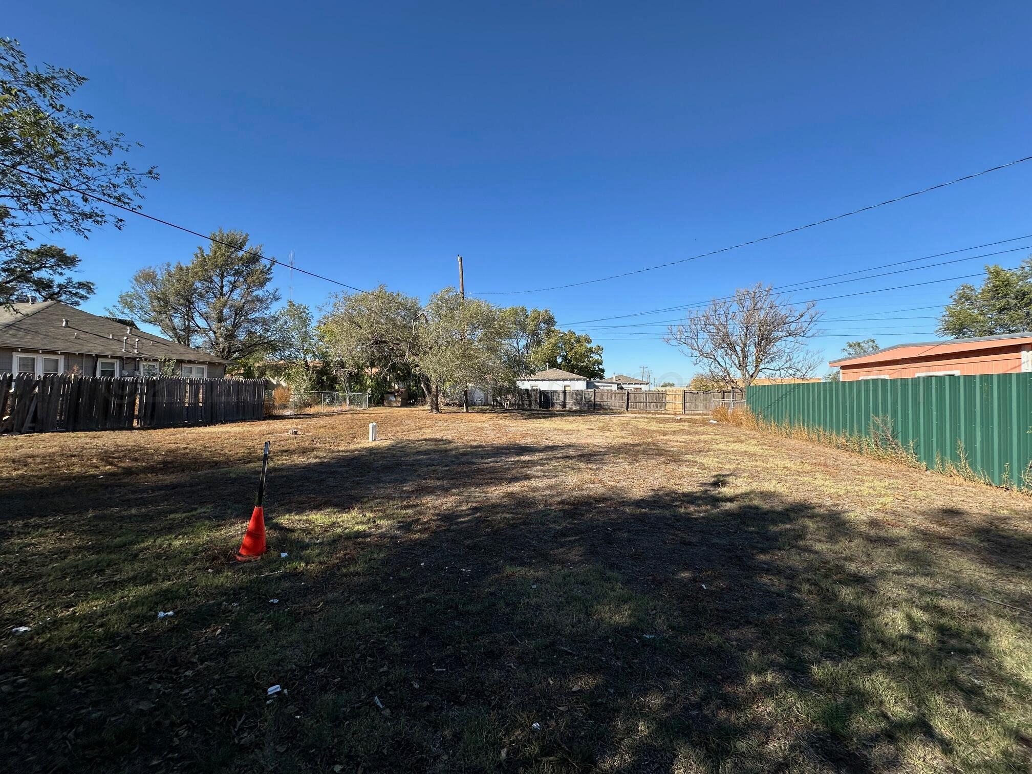 1406 Southwest 9th Avenue Amarillo, TX 79101 - Photo 3 of 8 a backyard of a house with lots of green space