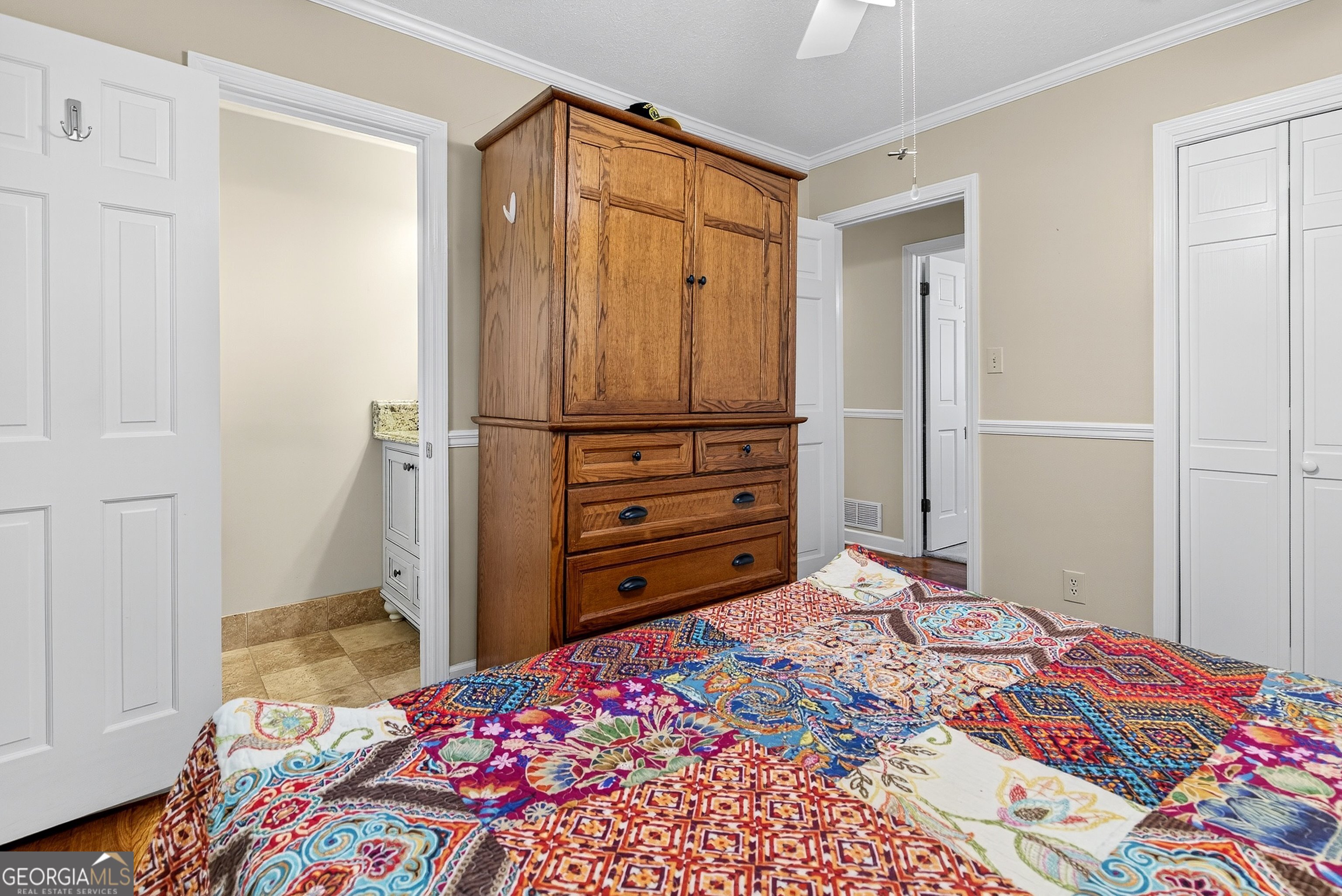 466 Minter Drive Hampton, GA 30228 - Photo 17 of 81 a bedroom with a bed and a dresser in it