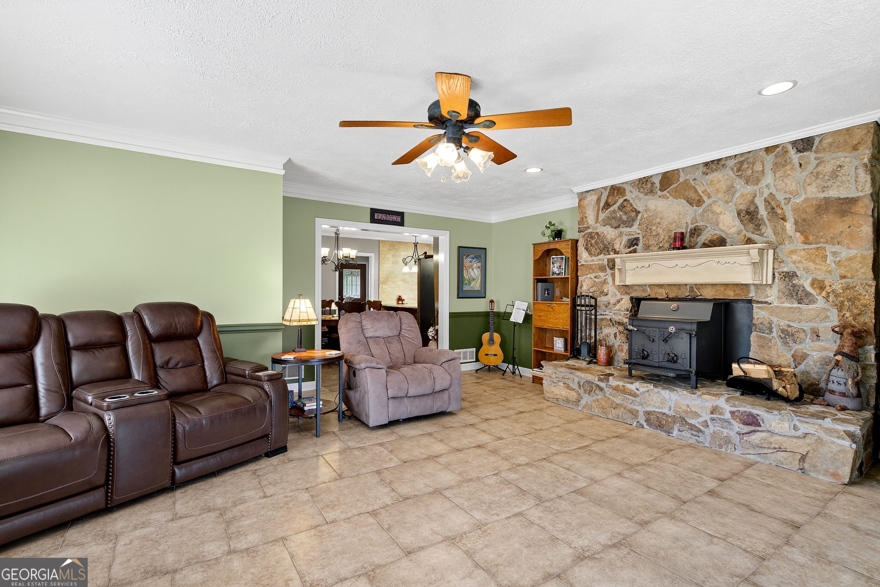466 Minter Drive Hampton, GA 30228 - Photo 20 of 81 a living room with furniture a fireplace and a fireplace