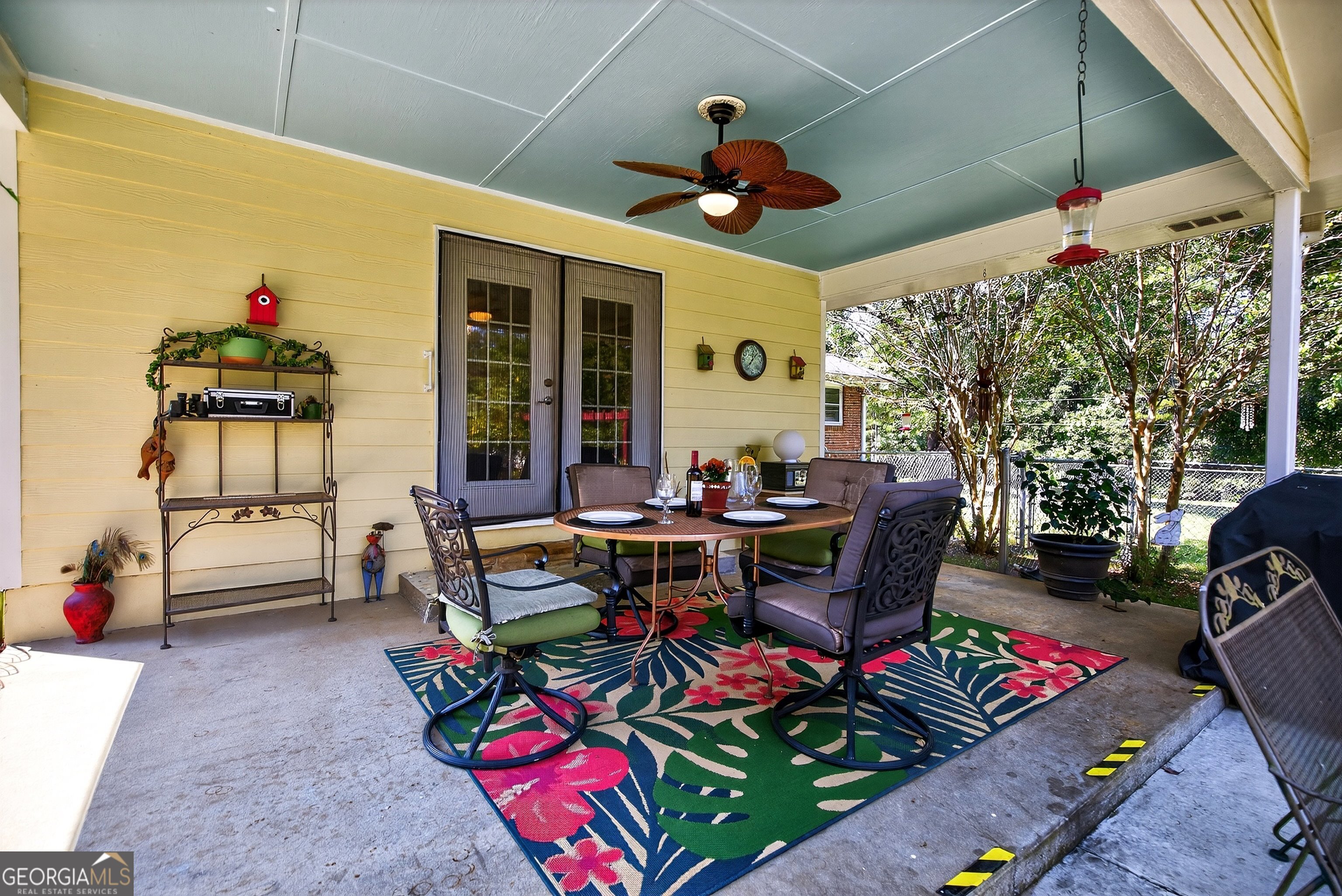 466 Minter Drive Hampton, GA 30228 - Photo 23 of 81 a view of a dining tables and chairs in a patio