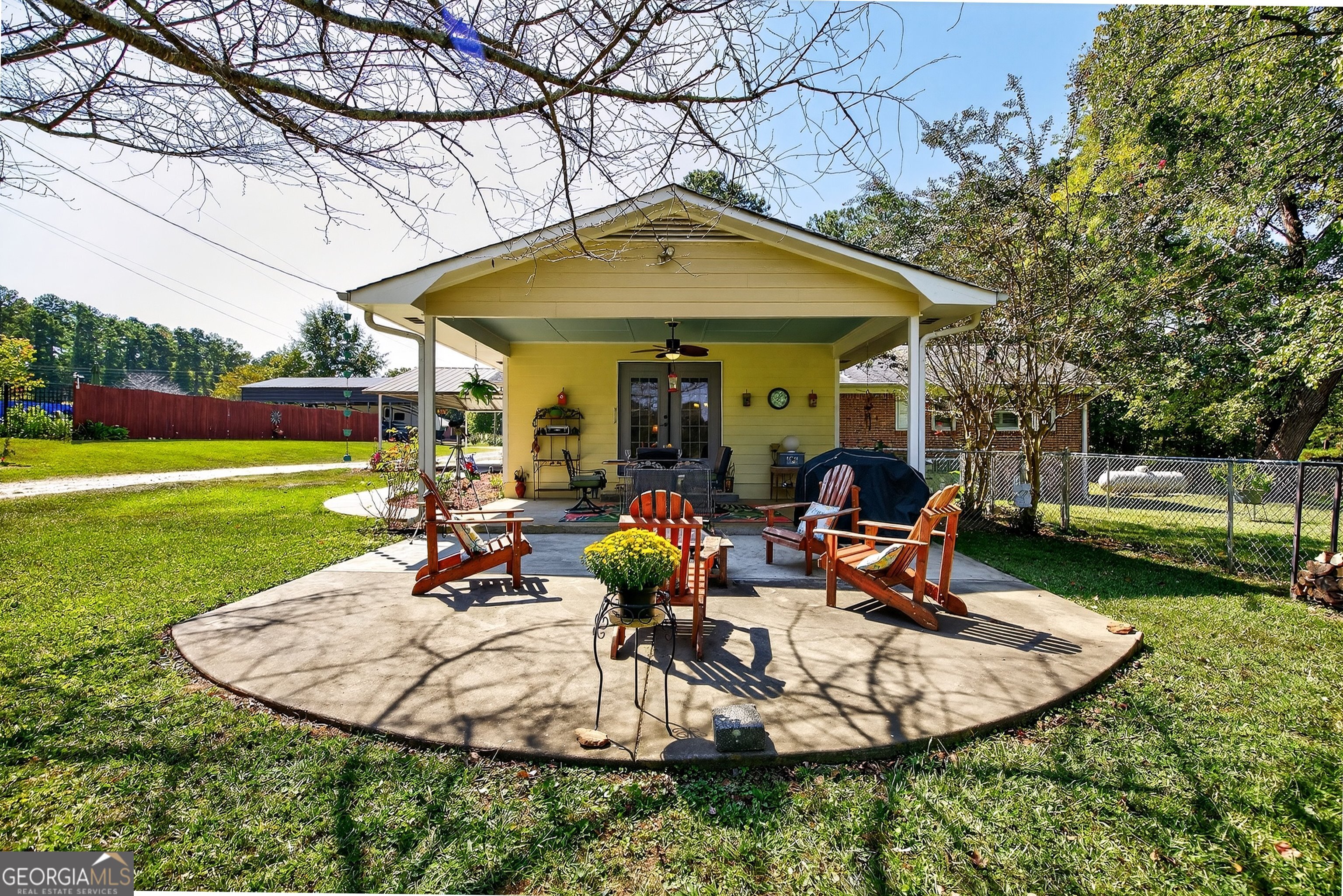 466 Minter Drive Hampton, GA 30228 - Photo 25 of 81 The extended patio offers even more possibilities! We love the set up with the firepit to enjoy cooler evenings outside!