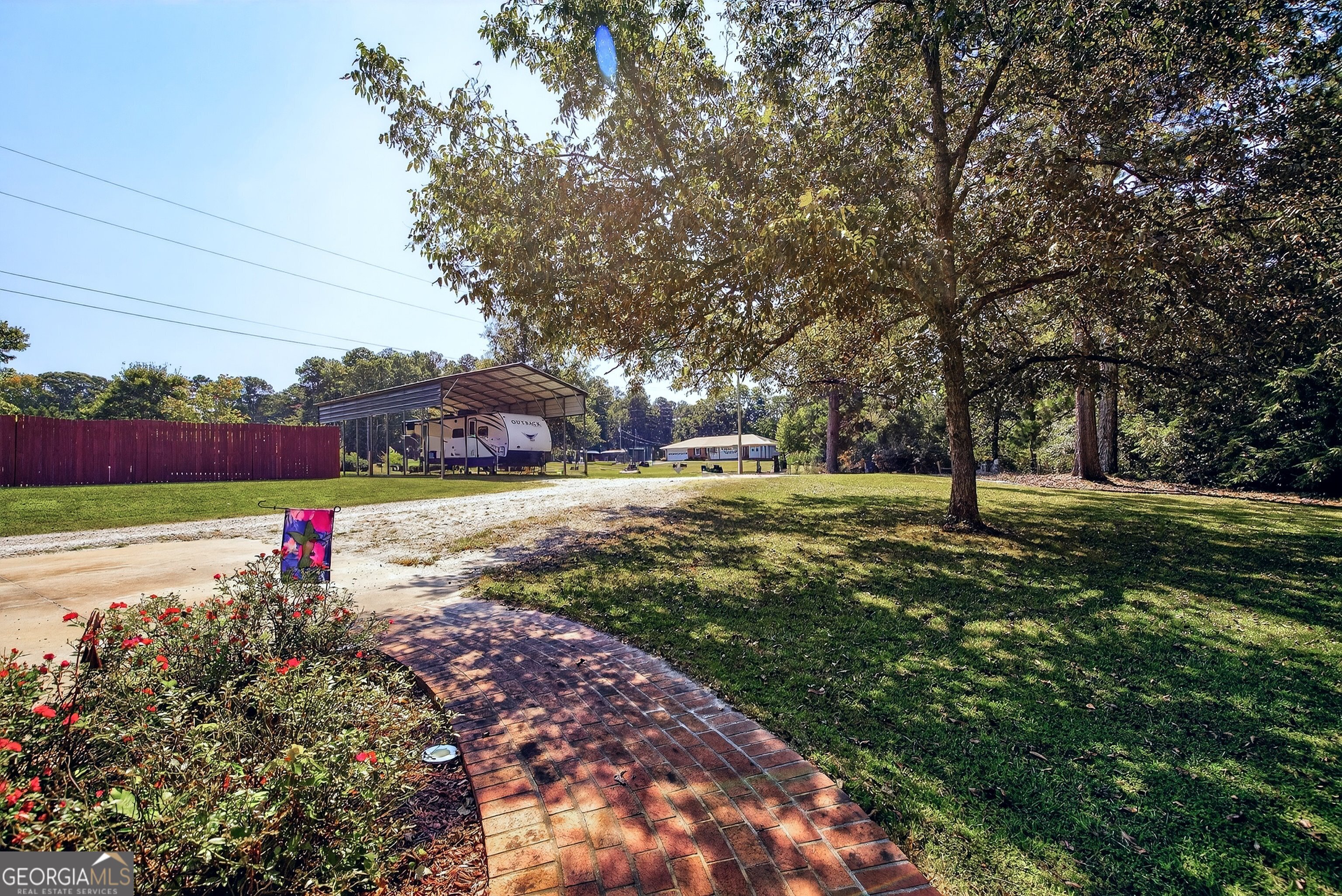 466 Minter Drive Hampton, GA 30228 - Photo 27 of 81 This property also offers covered parking options for your recreational vehicle too! There is even enough space to park other vehicles in addition to an RV. Amazing!
