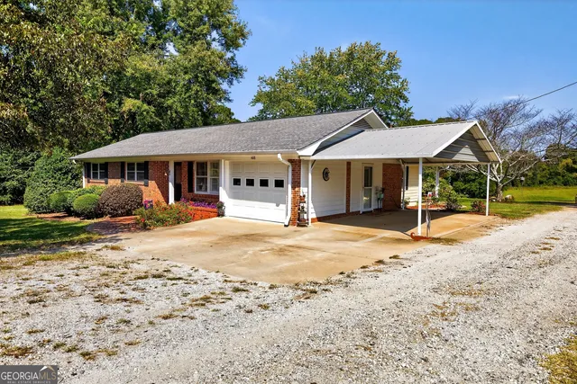a kitchen with stainless steel appliances granite countertop a refrigerator sink stove and cabinets