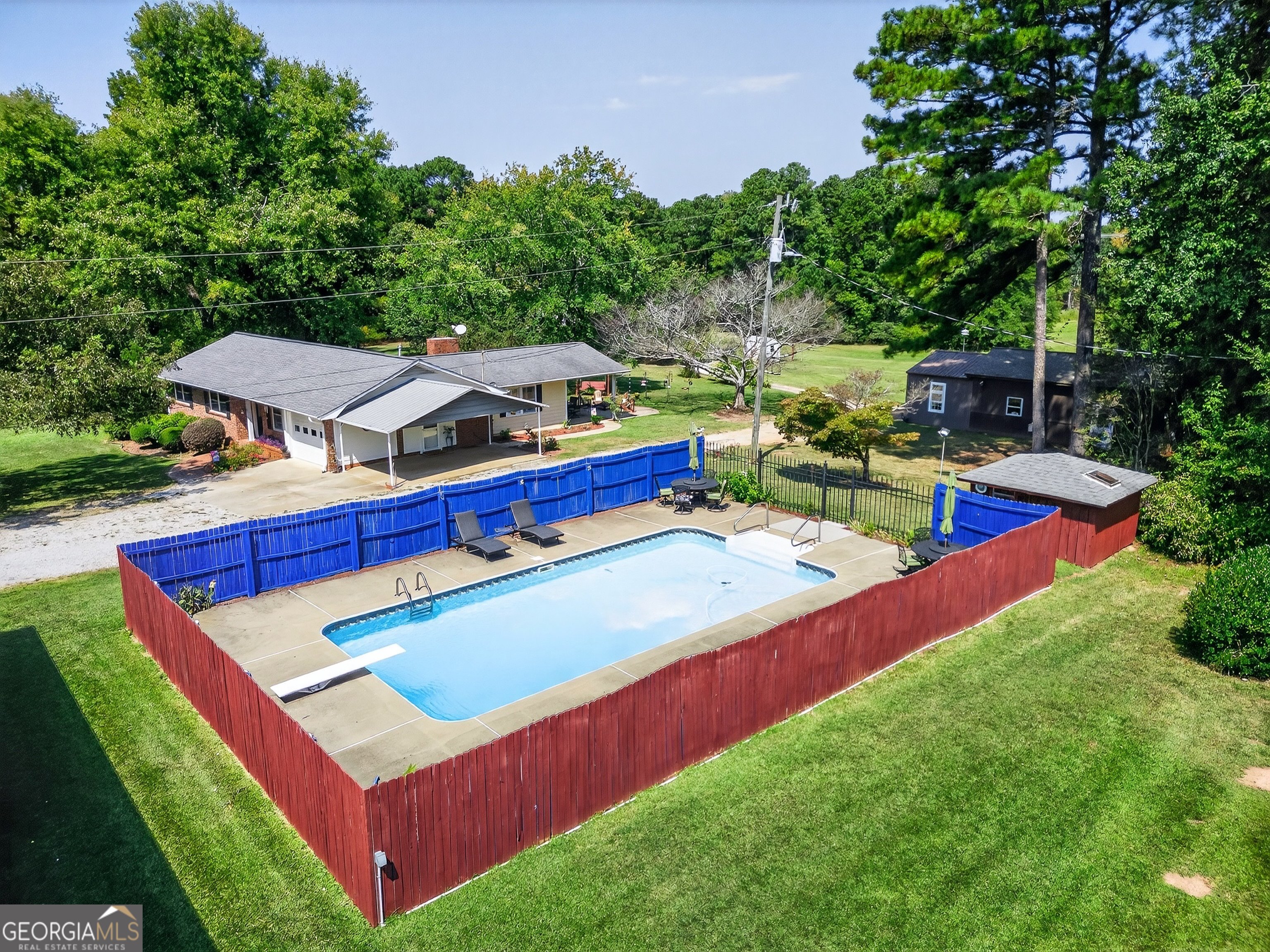 466 Minter Drive Hampton, GA 30228 - Photo 37 of 81 a view of an house with backyard space and seating area