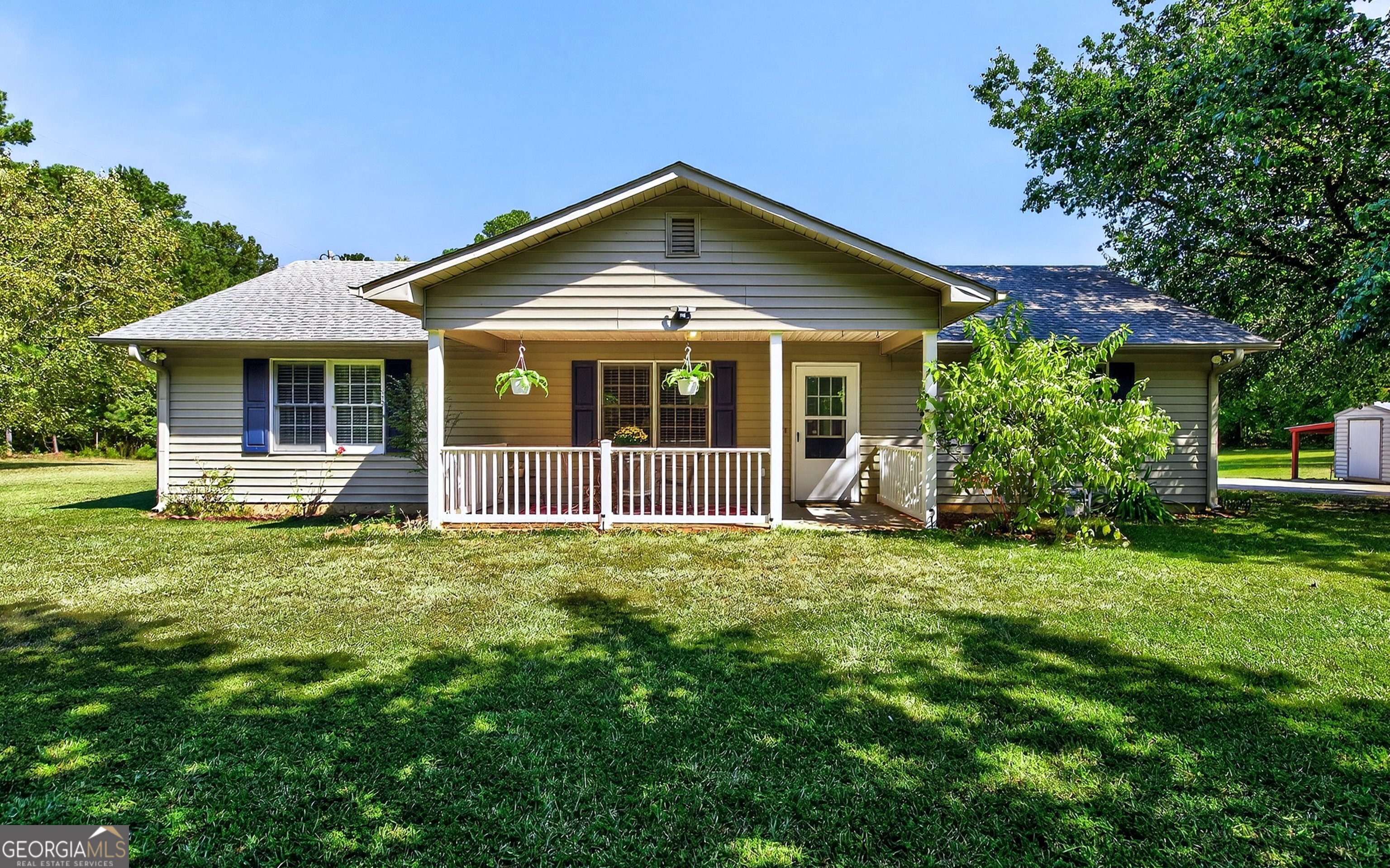 466 Minter Drive Hampton, GA 30228 - Photo 38 of 81 a front view of a house with a garden