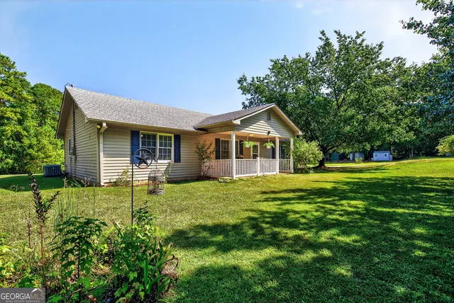 a en suite bathroom with a sink a mirror and a shower