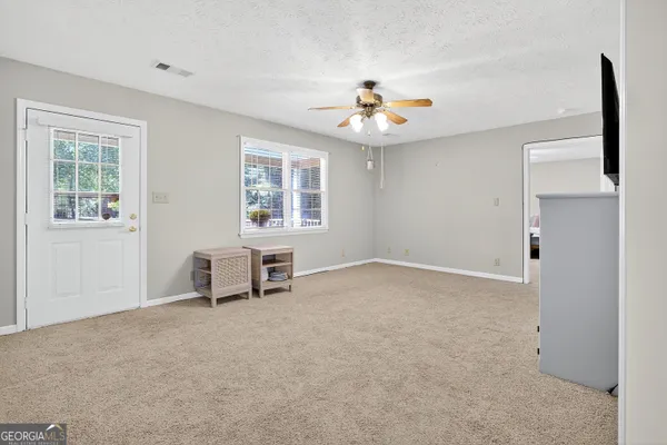 an aerial view of a house with a yard