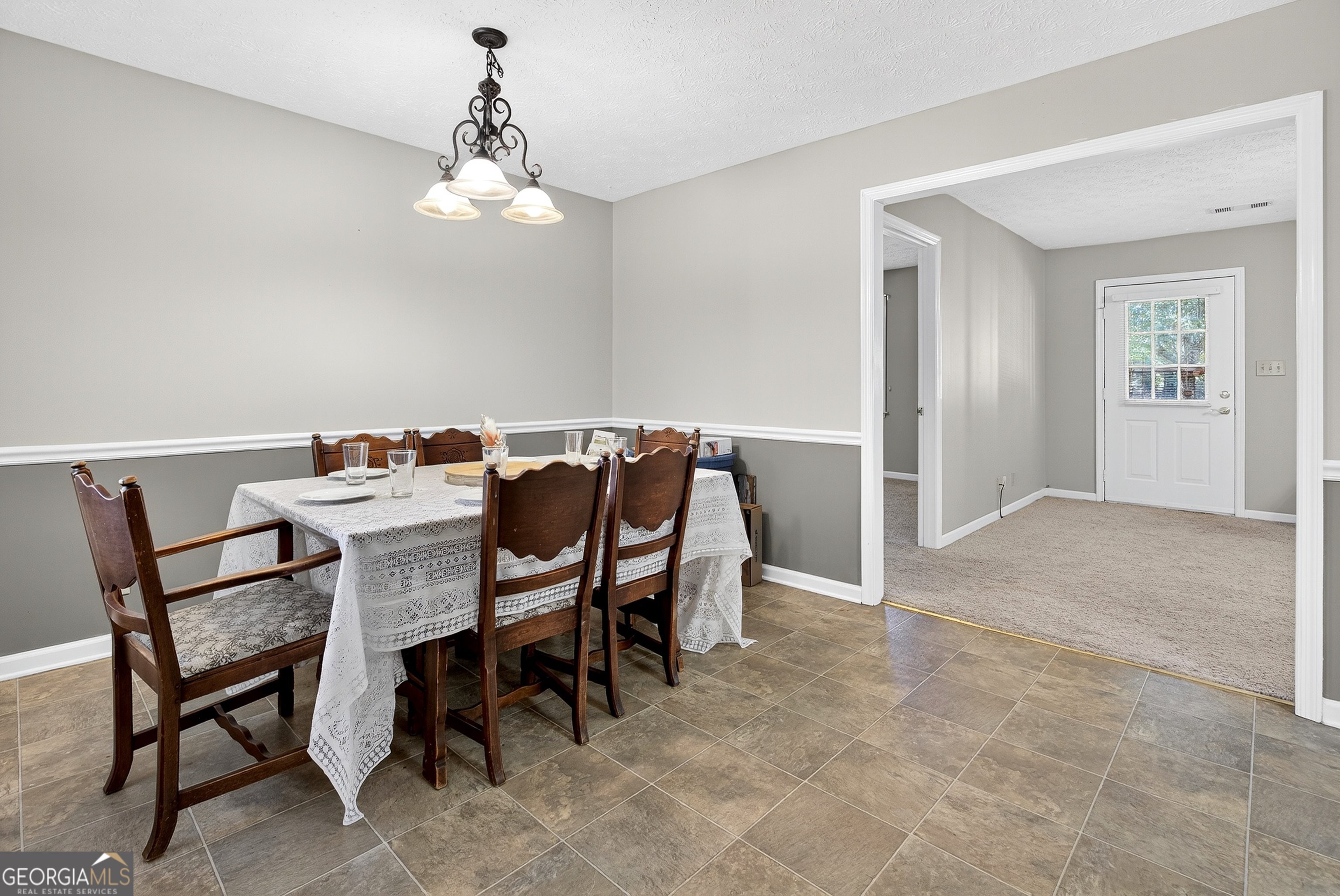 466 Minter Drive Hampton, GA 30228 - Photo 46 of 81 a view of a dining room with furniture and chandelier