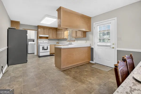 a view of a swimming pool with an outdoor space and seating area