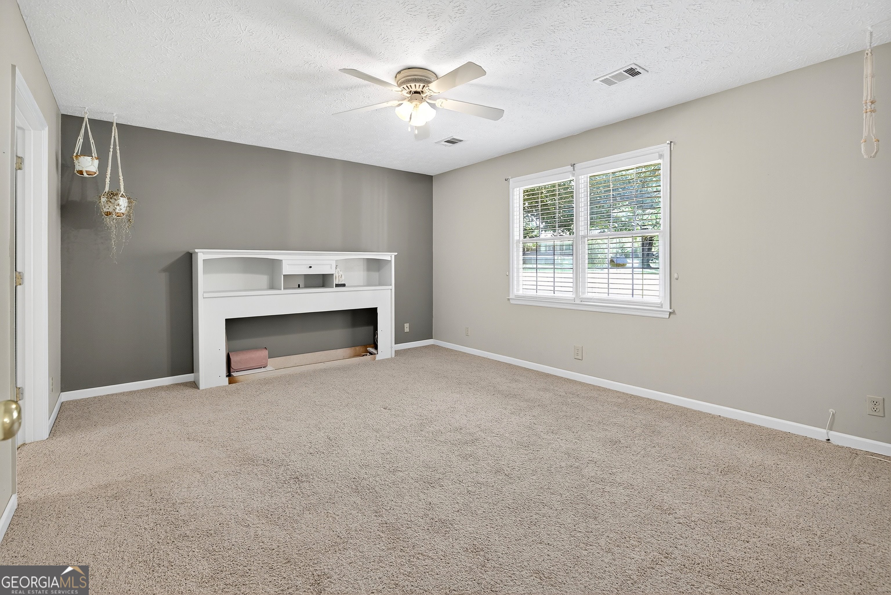 466 Minter Drive Hampton, GA 30228 - Photo 51 of 81 an empty room with windows and fireplace