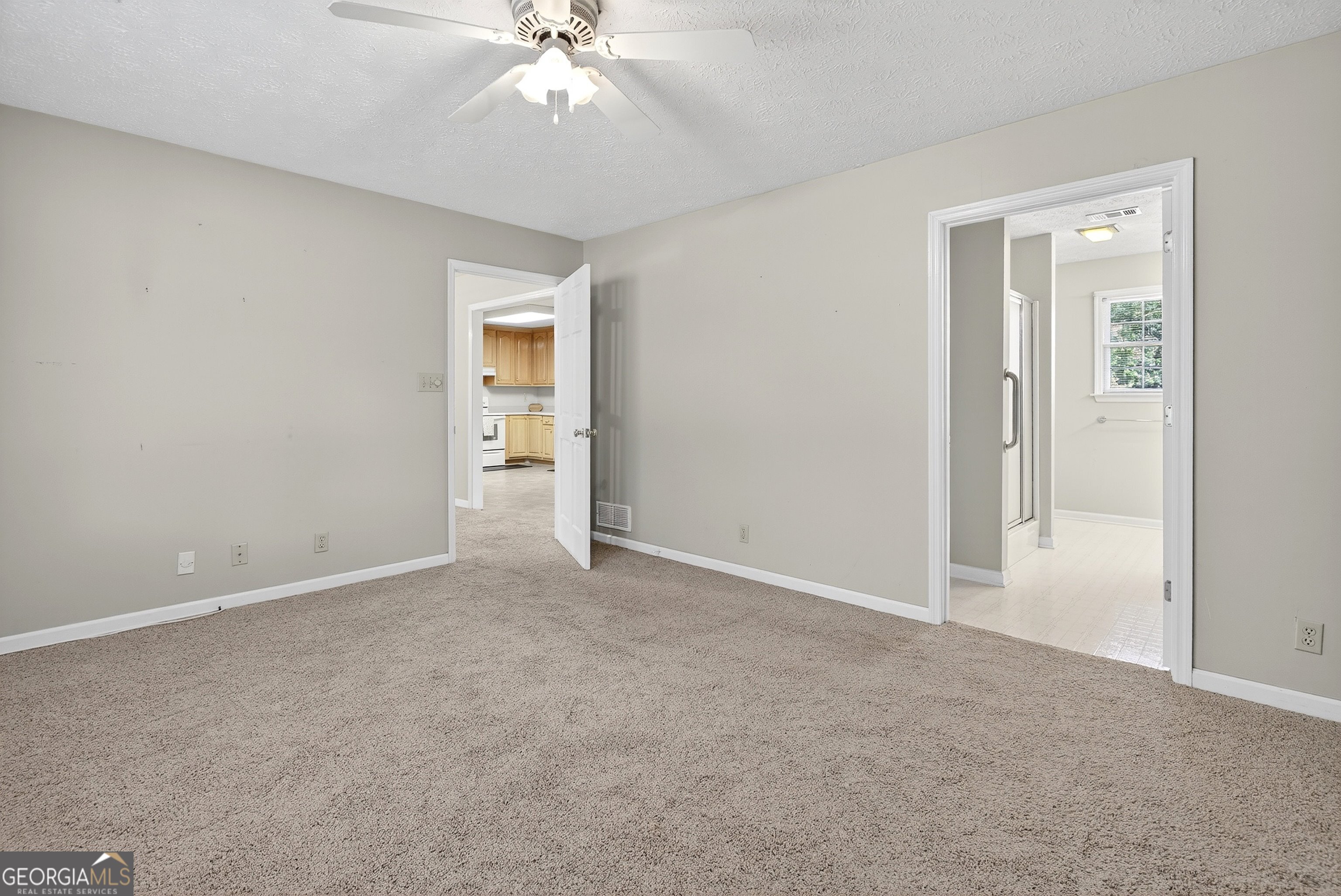 466 Minter Drive Hampton, GA 30228 - Photo 52 of 81 a view of an empty room with a chandelier fan