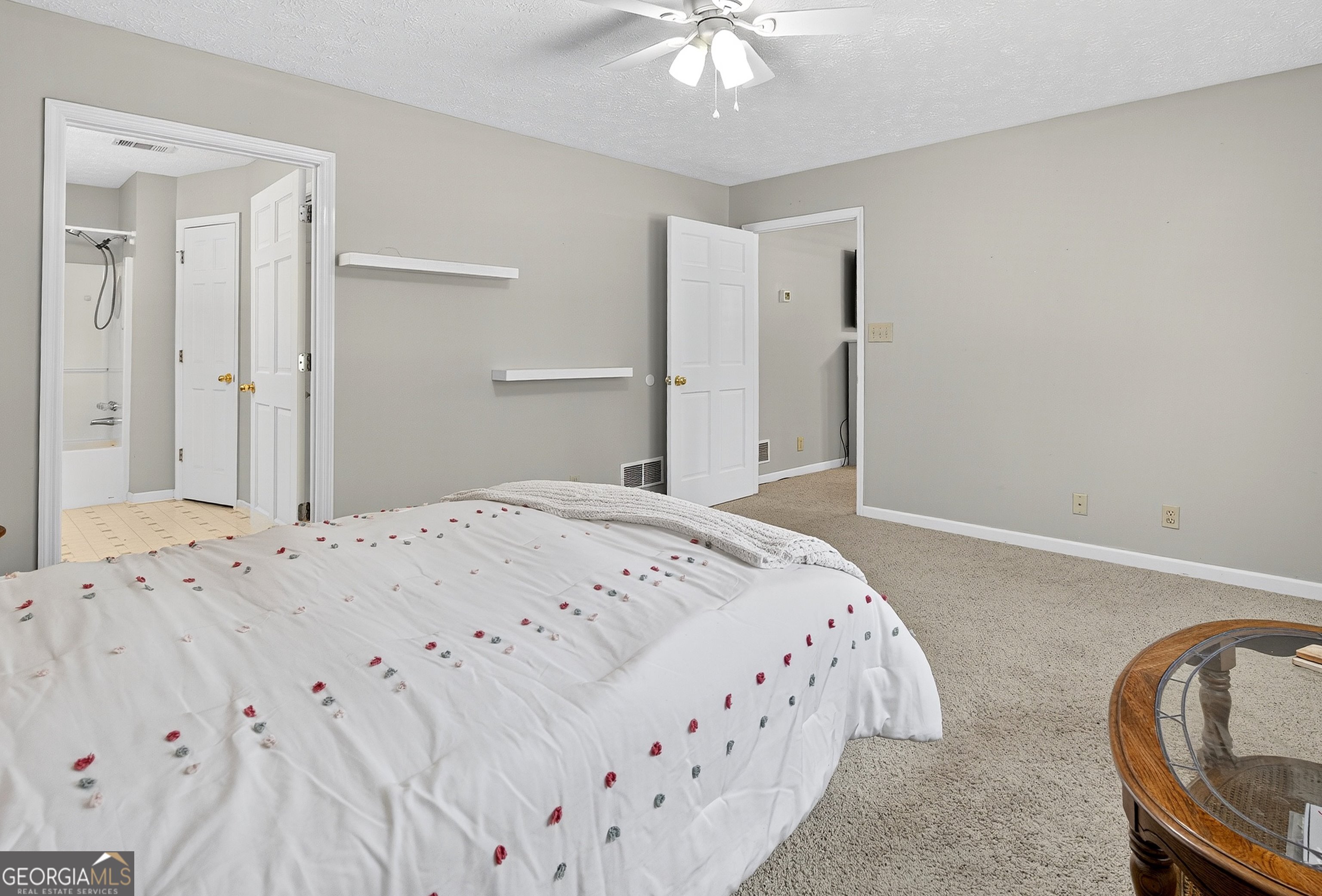 466 Minter Drive Hampton, GA 30228 - Photo 56 of 81 a bedroom with a bed and a chandelier