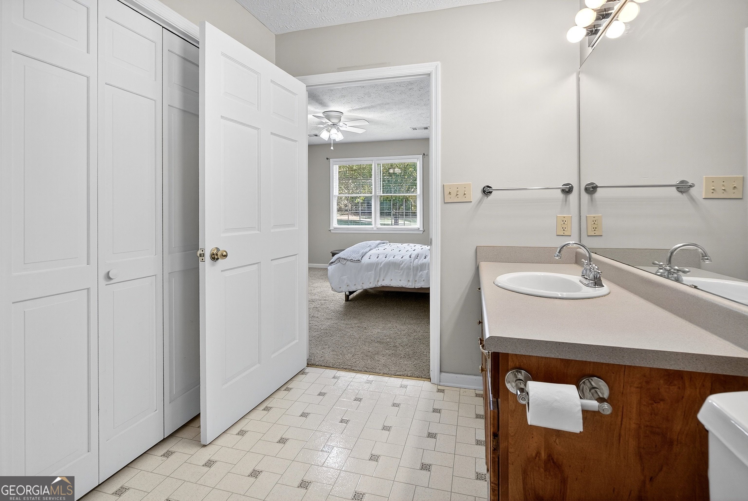 466 Minter Drive Hampton, GA 30228 - Photo 58 of 81 a en suite bathroom with a sink a mirror and a shower
