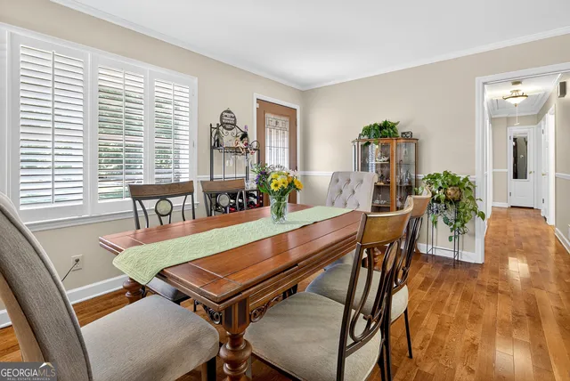 a kitchen with stainless steel appliances granite countertop a sink a stove and refrigerator