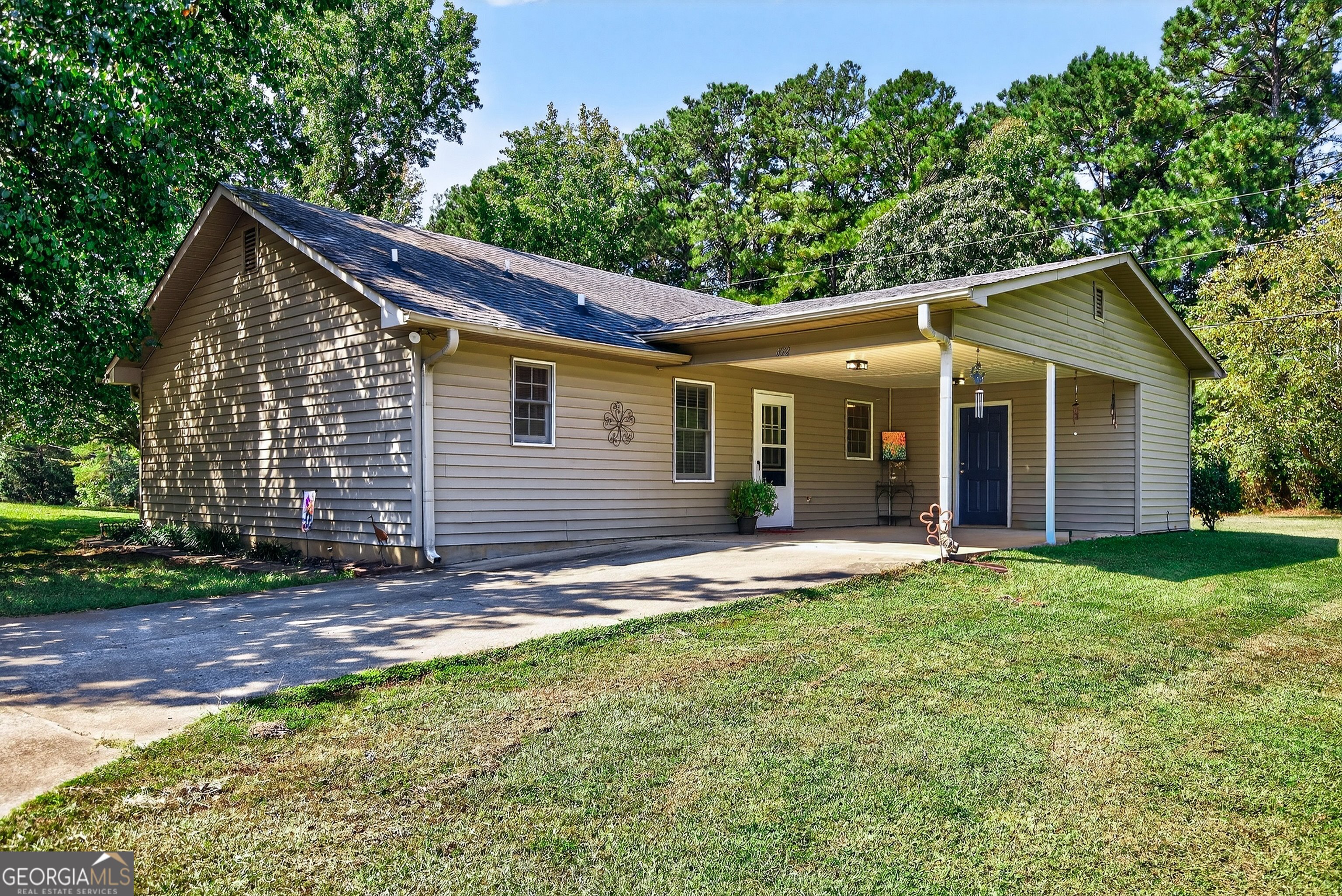 466 Minter Drive Hampton, GA 30228 - Photo 64 of 81 a view of a yard in front of a house with large tree