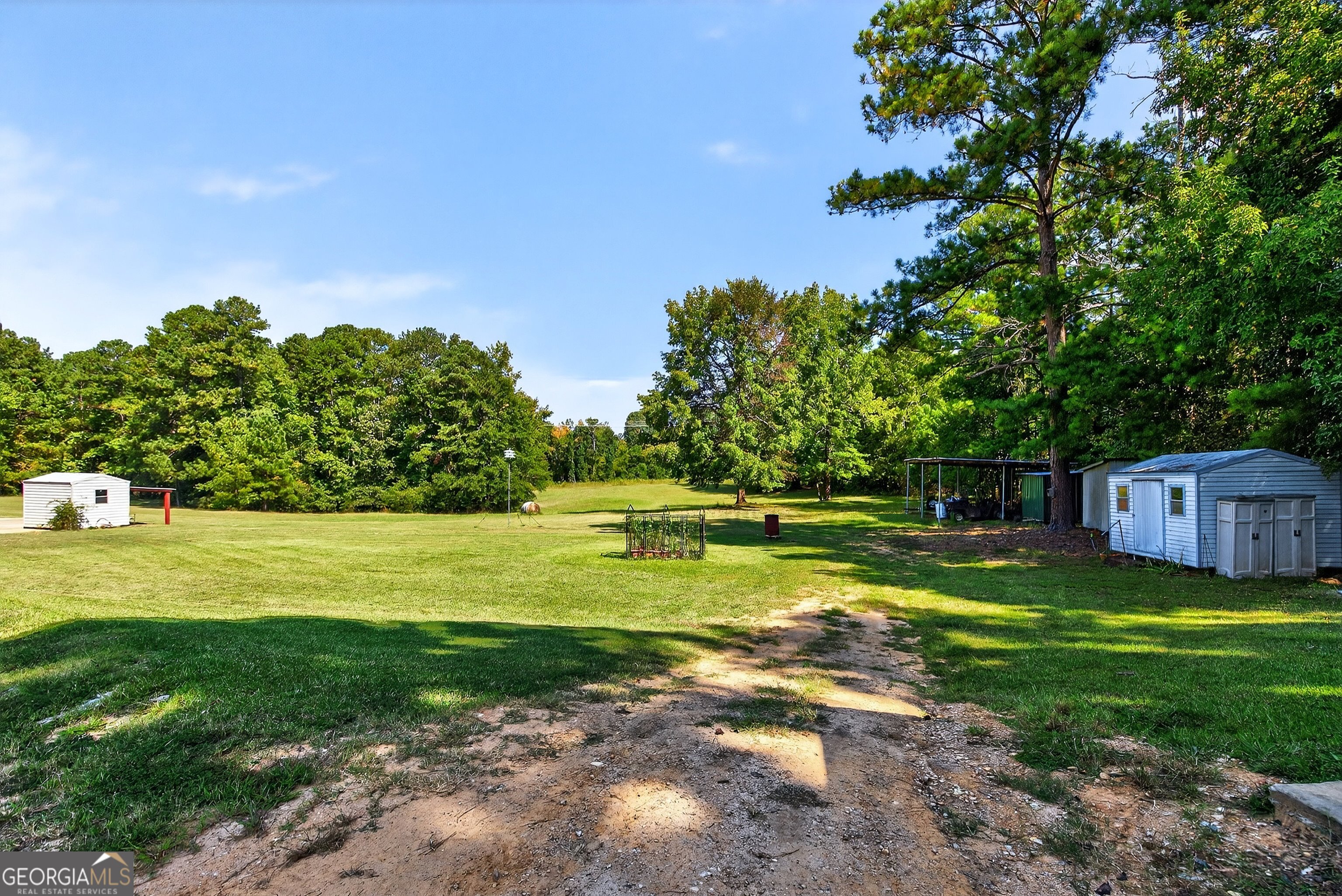 466 Minter Drive Hampton, GA 30228 - Photo 72 of 81 a view of a swimming pool with an outdoor space and seating area