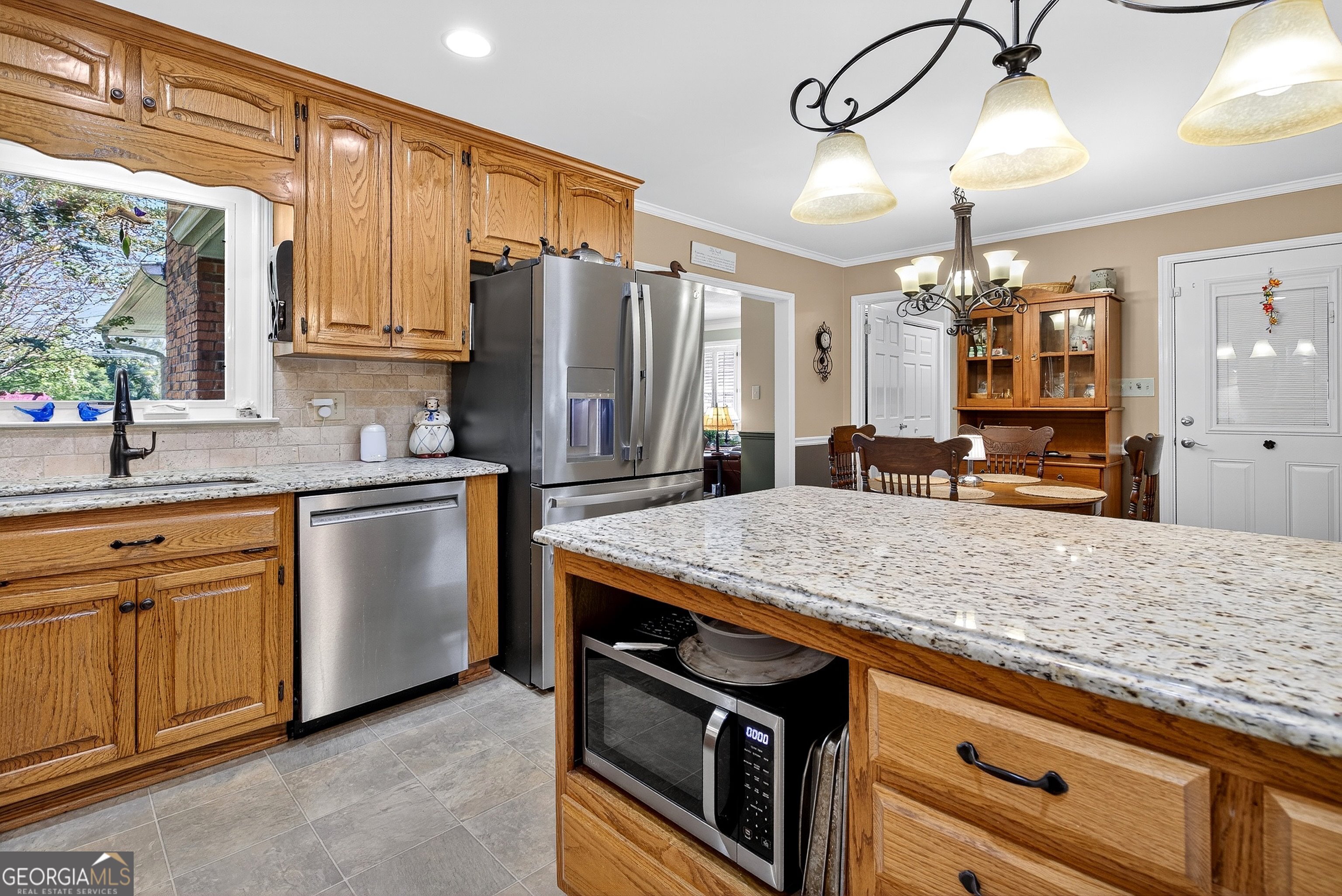 466 Minter Drive Hampton, GA 30228 - Photo 8 of 81 a kitchen with stainless steel appliances granite countertop a sink a stove and refrigerator