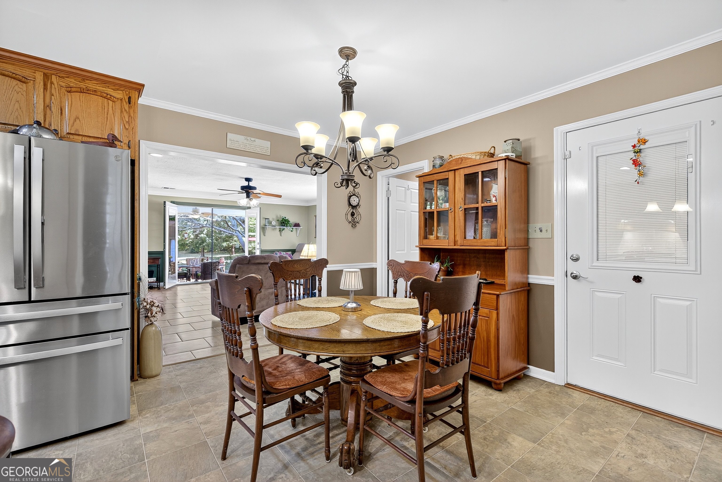 466 Minter Drive Hampton, GA 30228 - Photo 9 of 81 a dining room with furniture a chandelier and wooden floor